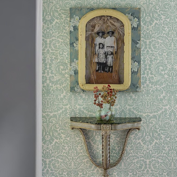 Four Family Mixed Media in shadowbox. Vintage wallpaper, copy of photo by H. Disfarmer, wheat, fabric, glass, frame. 2004 Photo courtesy Glenn Wallace Instagram.