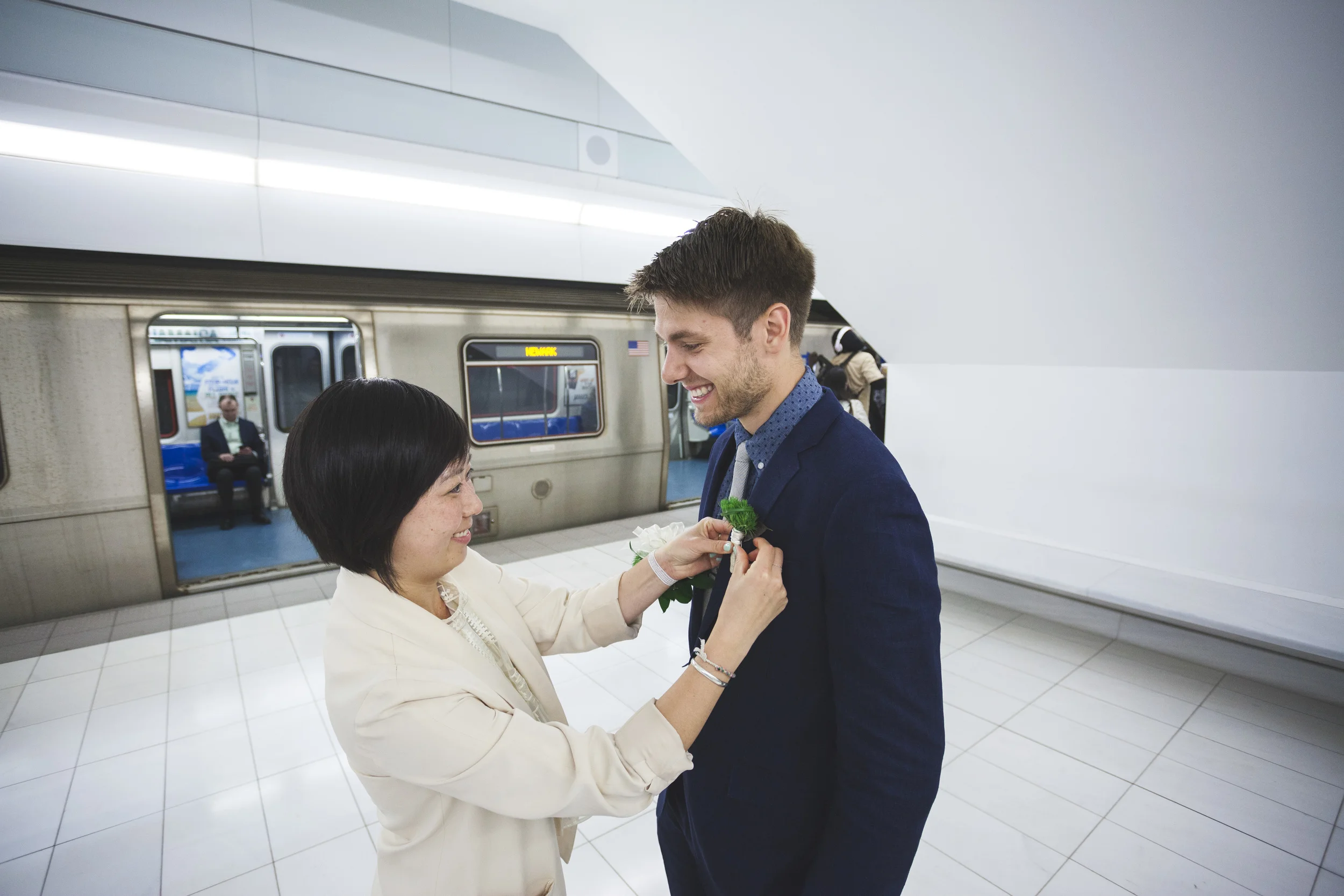Getting the boutonnière ready in the train station!