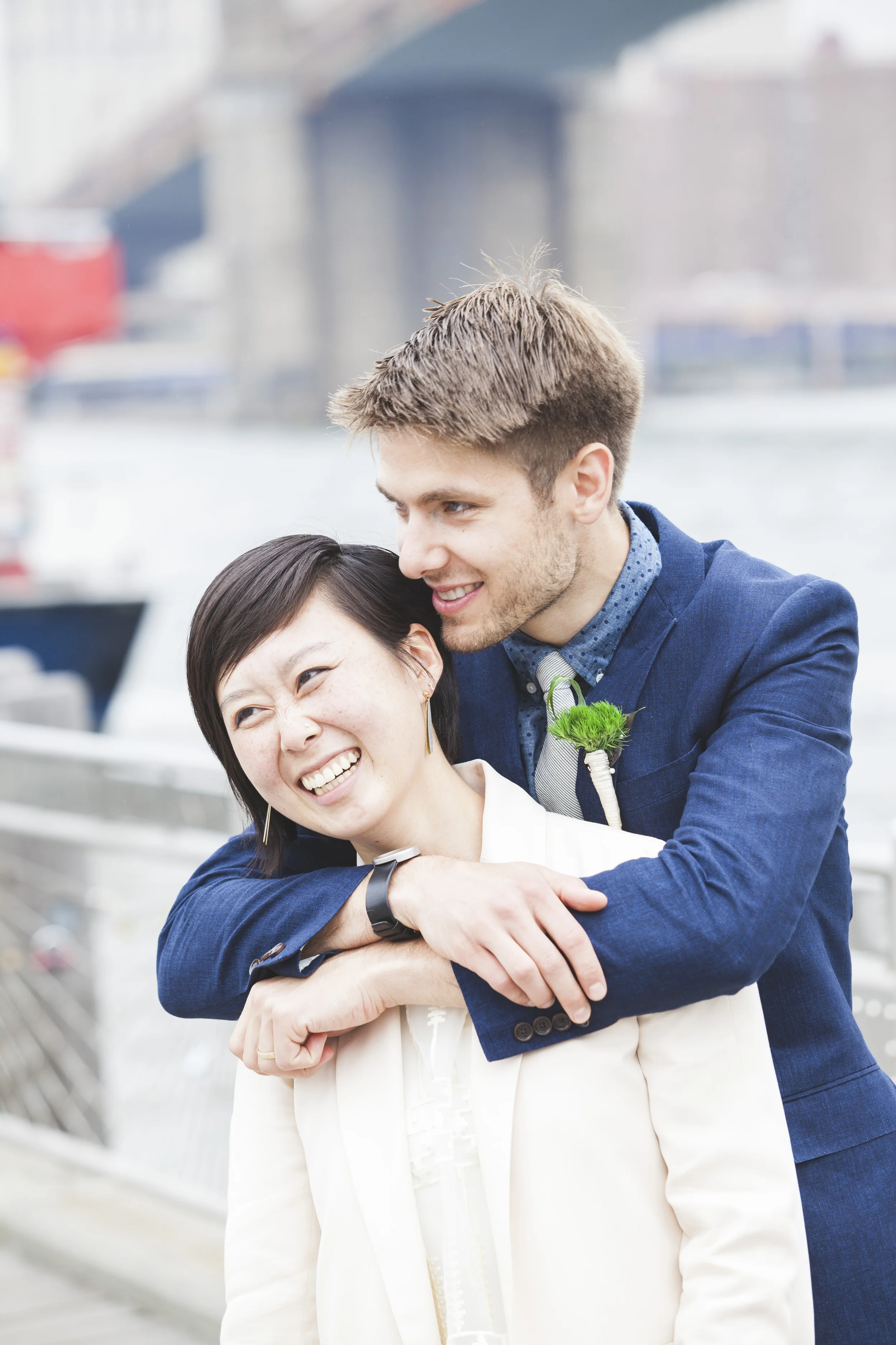 A sweet moment under the Brooklyn Bridge.