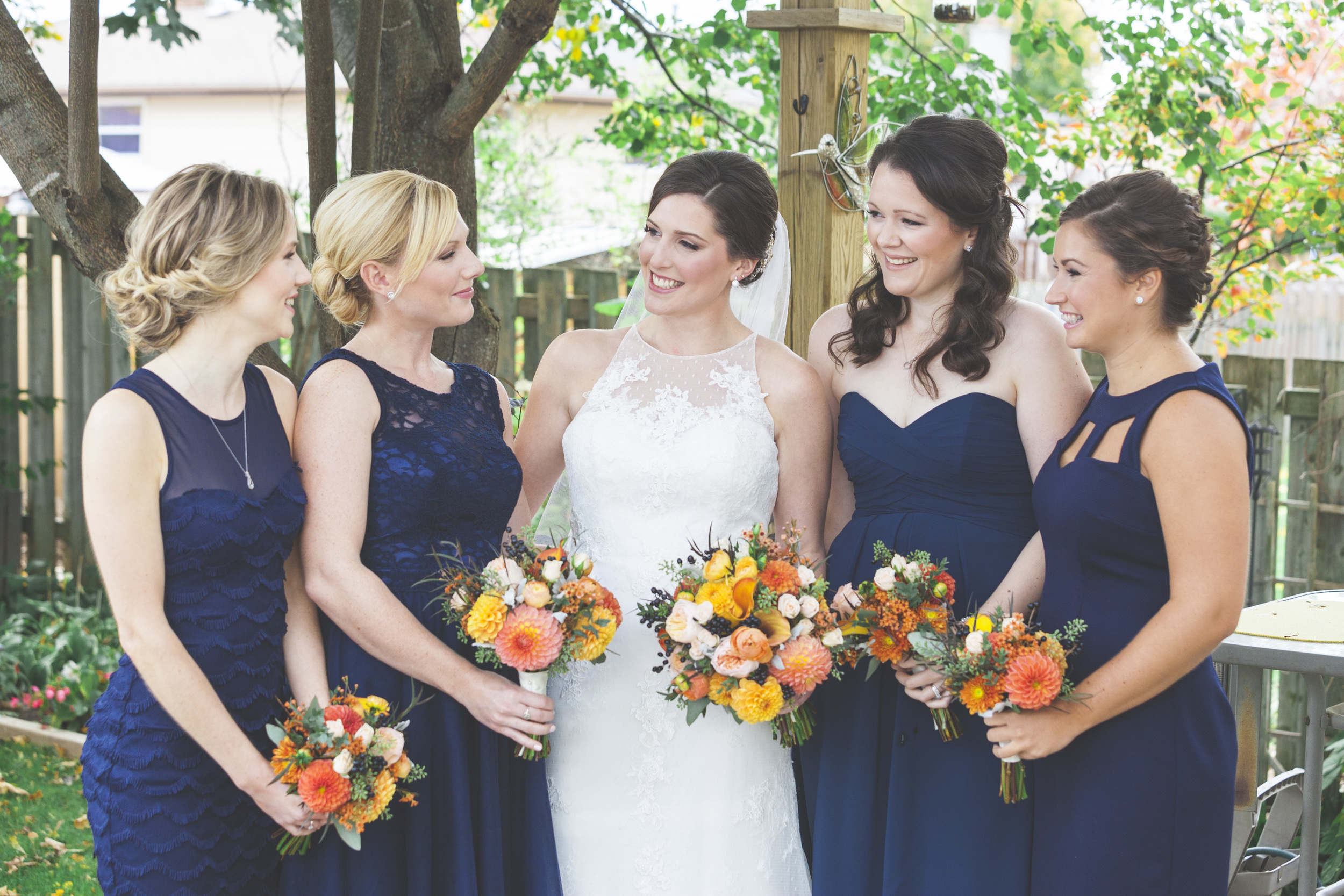 Backyard photo of the bride and bridesmaids.