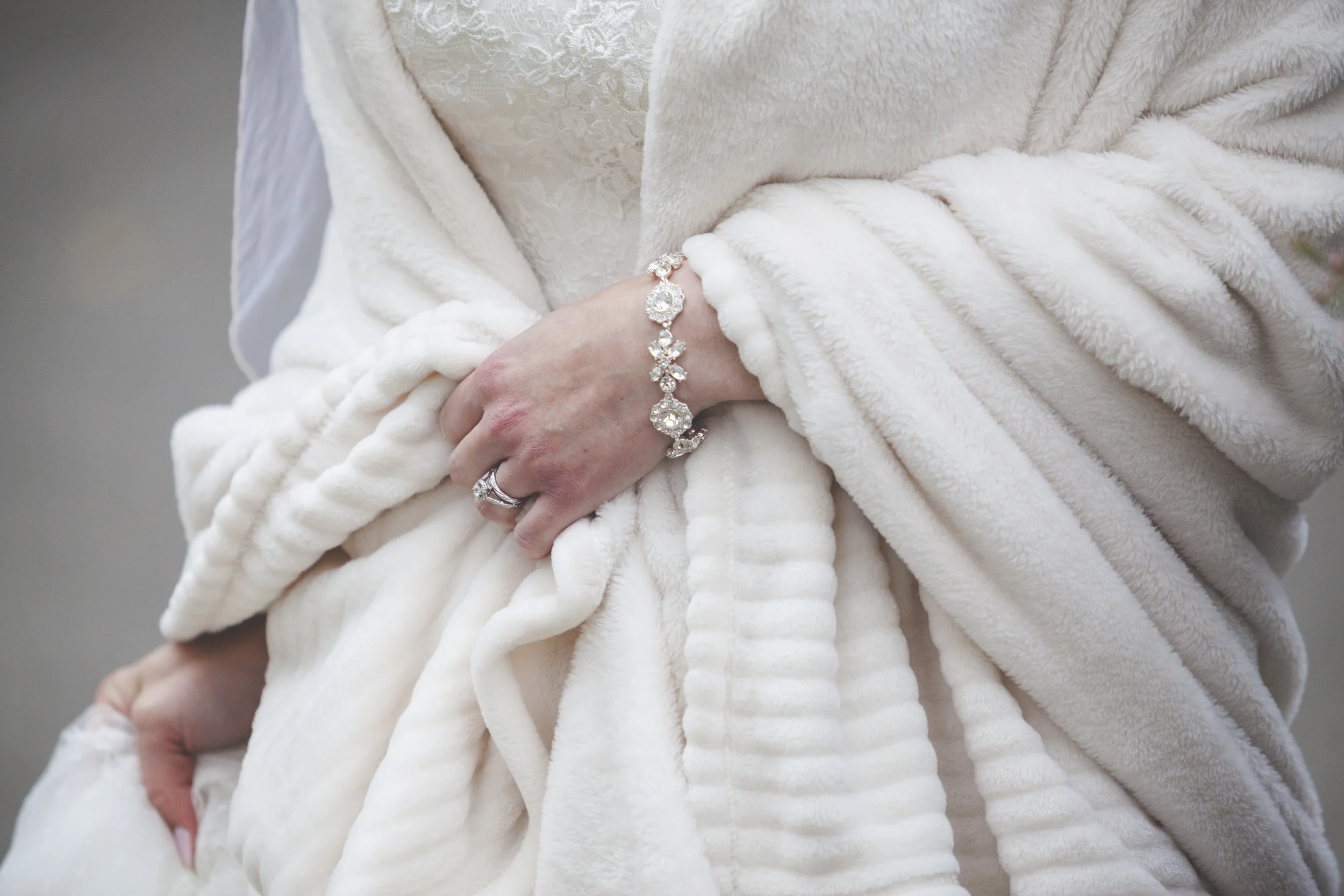 The bride keeping warm.