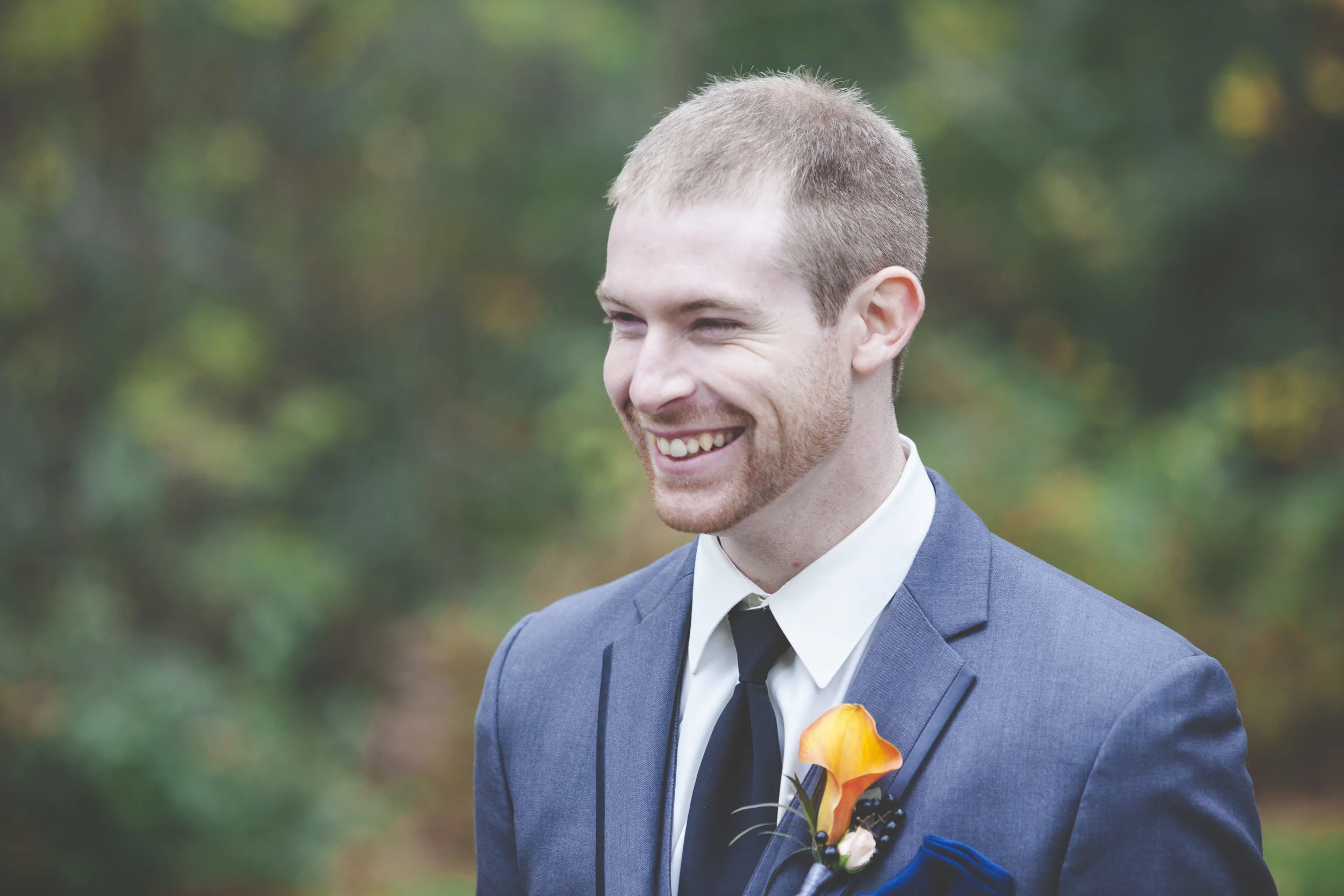 The groom is all smiles.