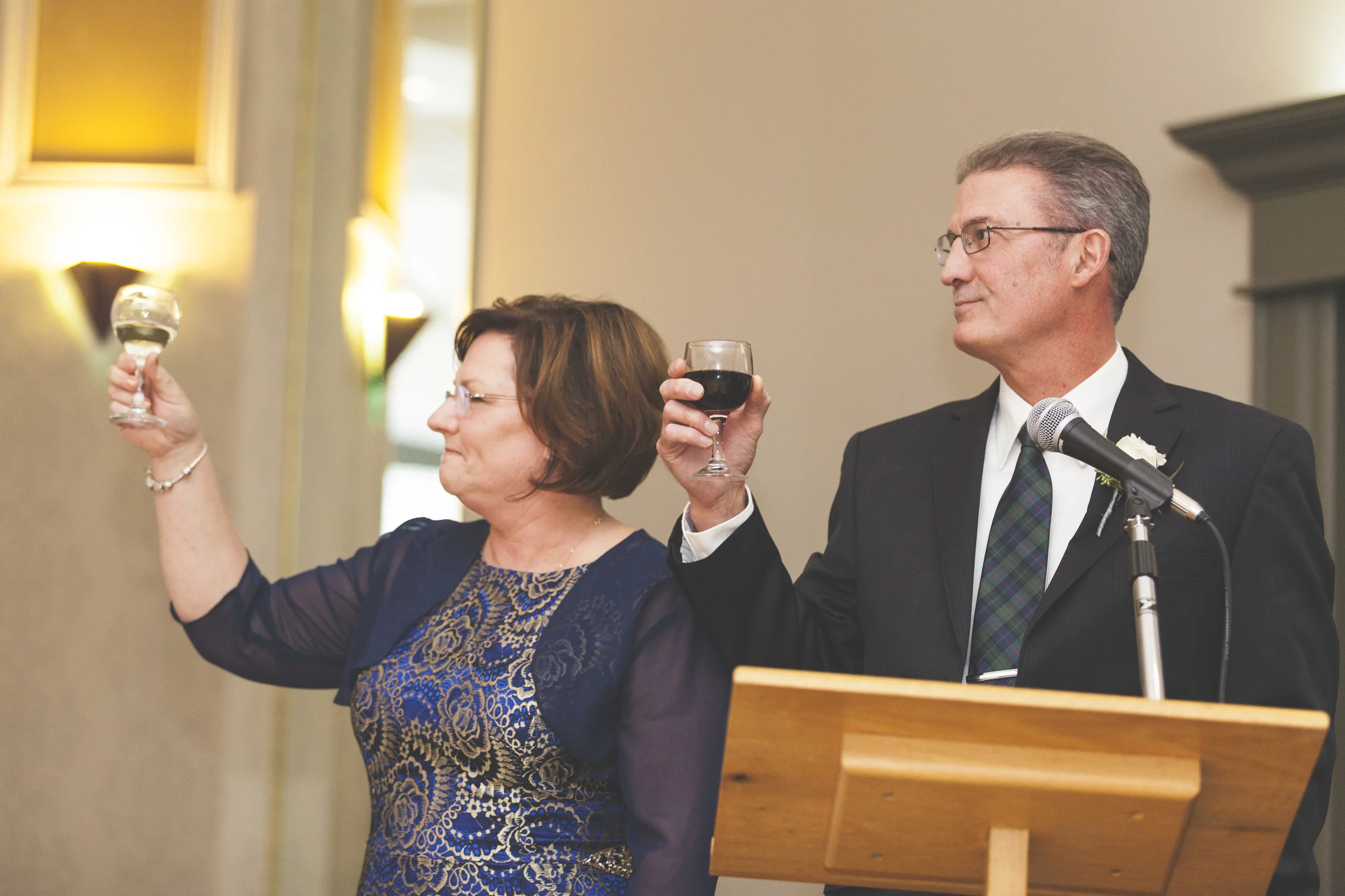 The proud parents raise a glass.