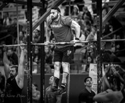 Dallas Henson Performing bar muscleups Photo Credit: Sierra Prime 
