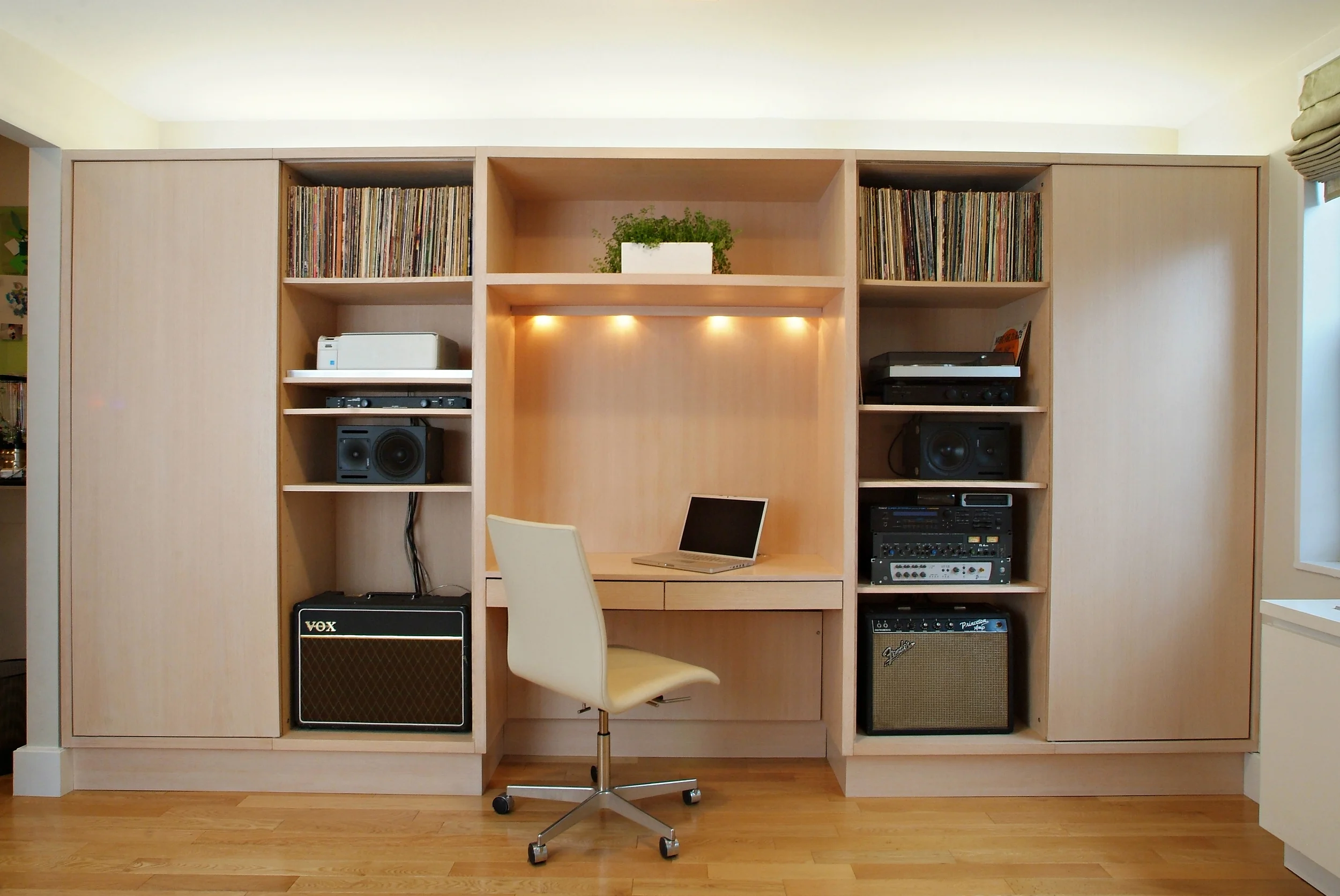 Husband's passion is music. The cabinetry design reveals his musical collection.
