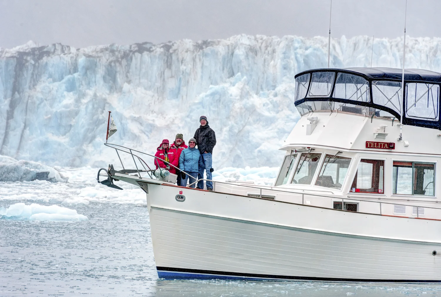 The crew of Telita bundled up in front of the Columbia Glacier