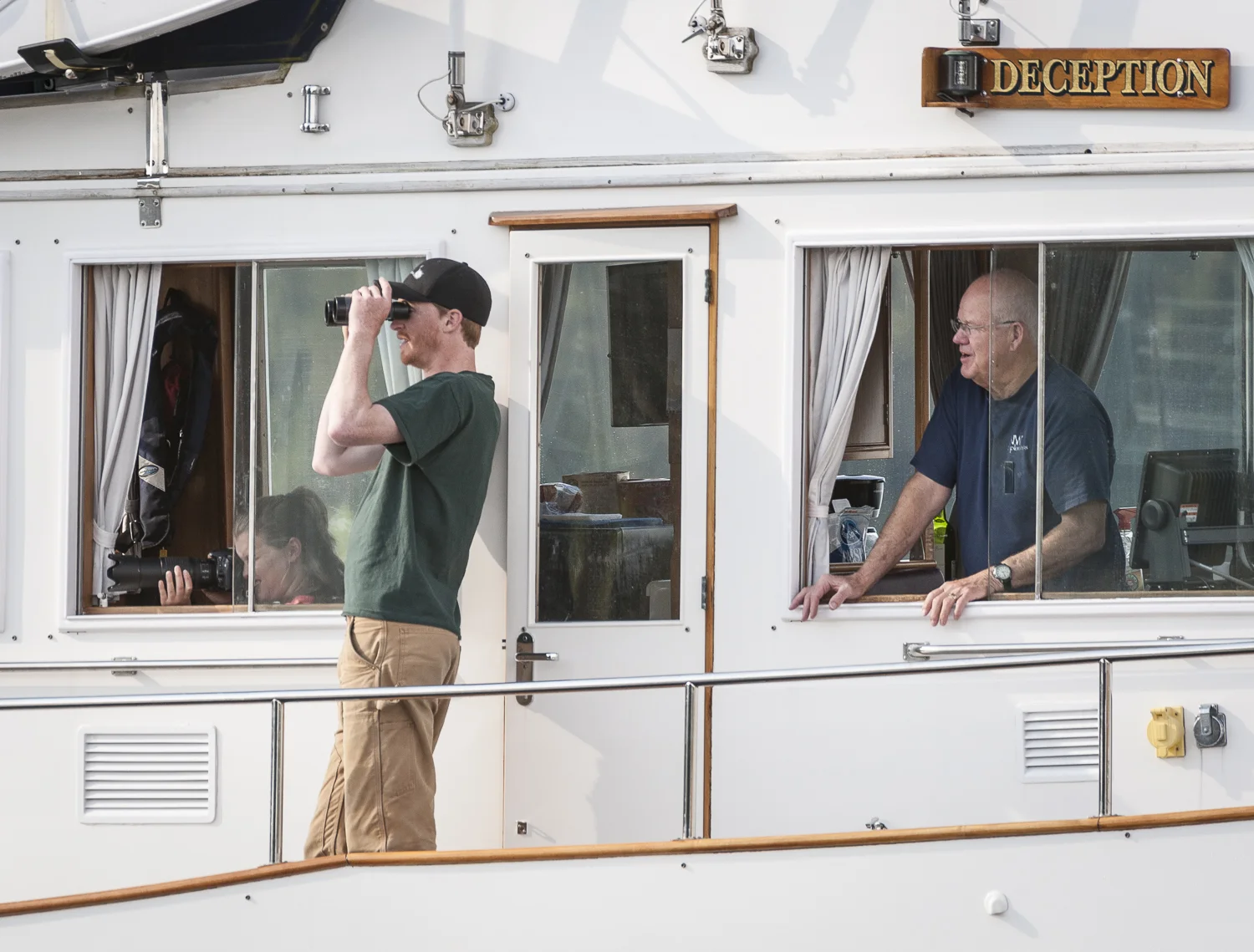 The crew of Deception stops to admire the humbacks