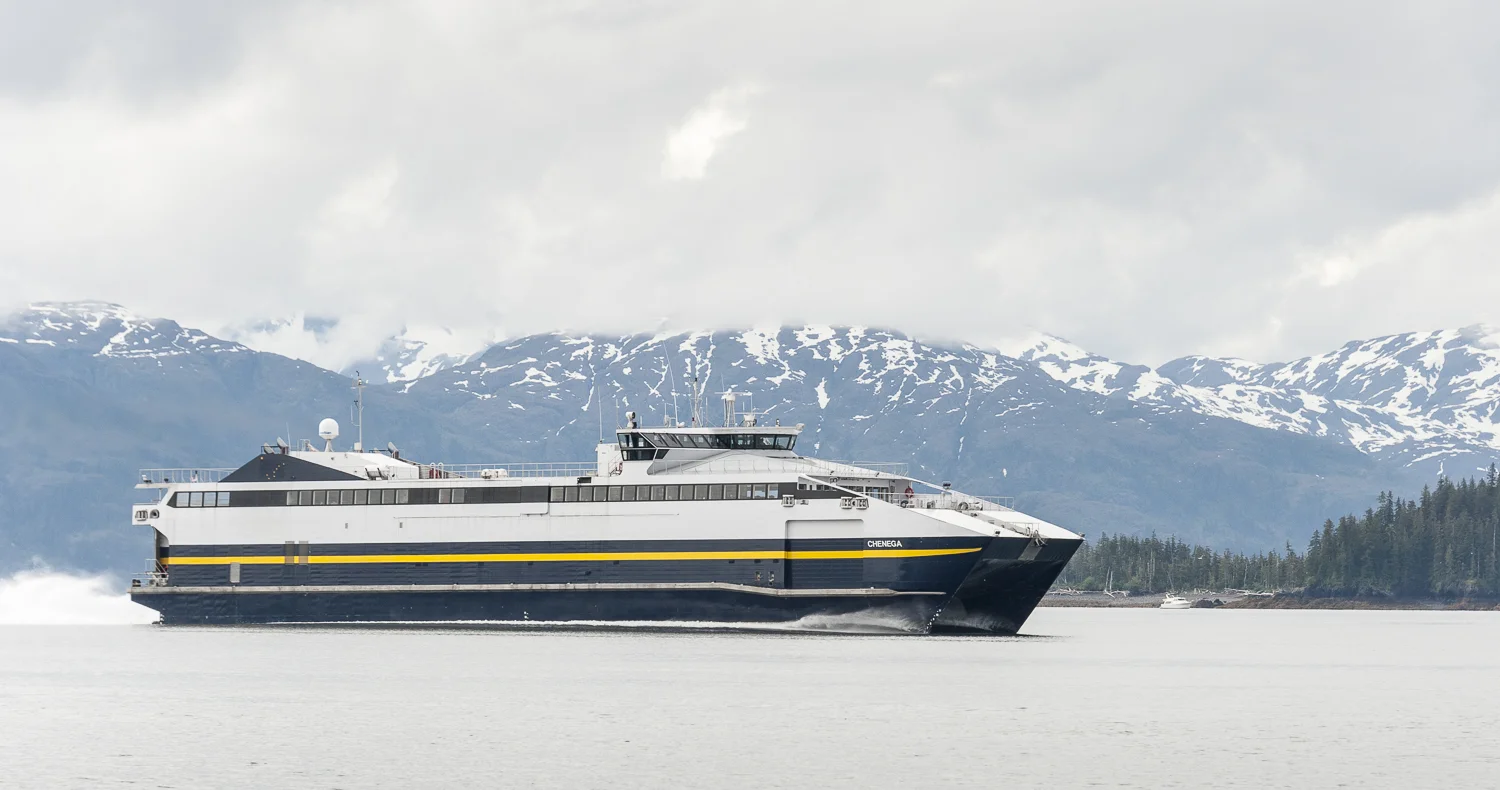 The high speed ferry, Chenga slips past the fleet at over 20 knots