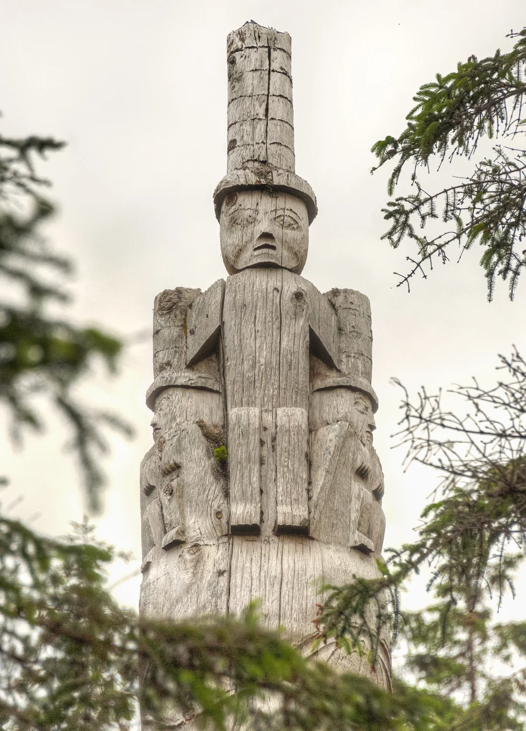 A not so traditional totem. Have the guides tell you why this totem is topped with this figure.