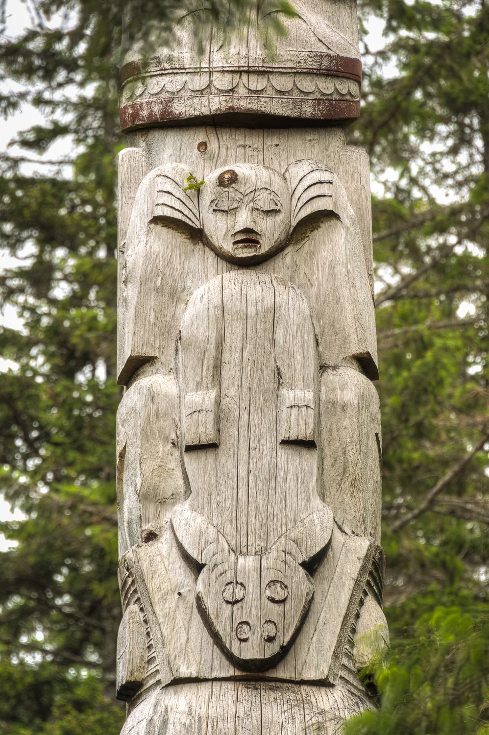 Anybody else see Bozo the Clown in this totem.