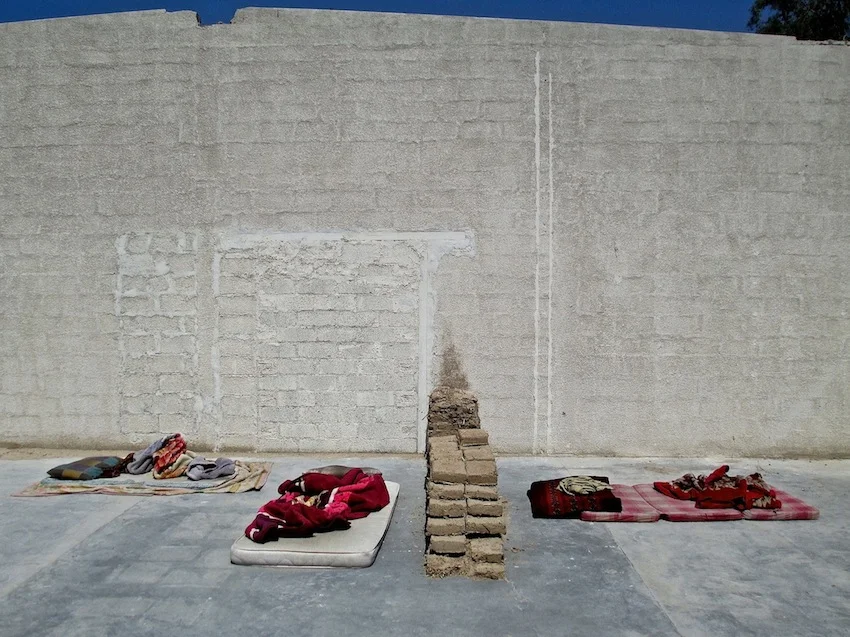 Images of the wall and the wall with tushaks by Amanullah Mojadidi. Images of the demolition by Nilo O. Pantig, Jr.