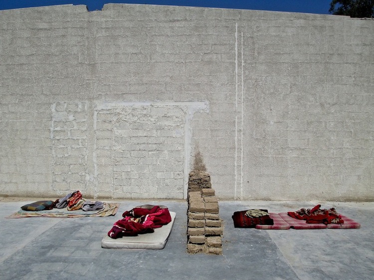 Images of the wall and the wall with tushaks by Amanullah Mojadidi. Images of the demolition by Nilo O. Pantig, Jr.