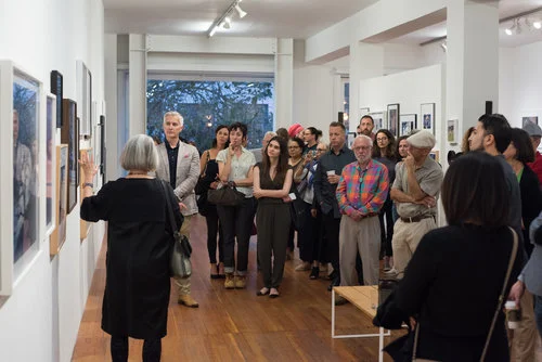 Sandra Phillips leads visitors through the 2018 Auction Exhibition