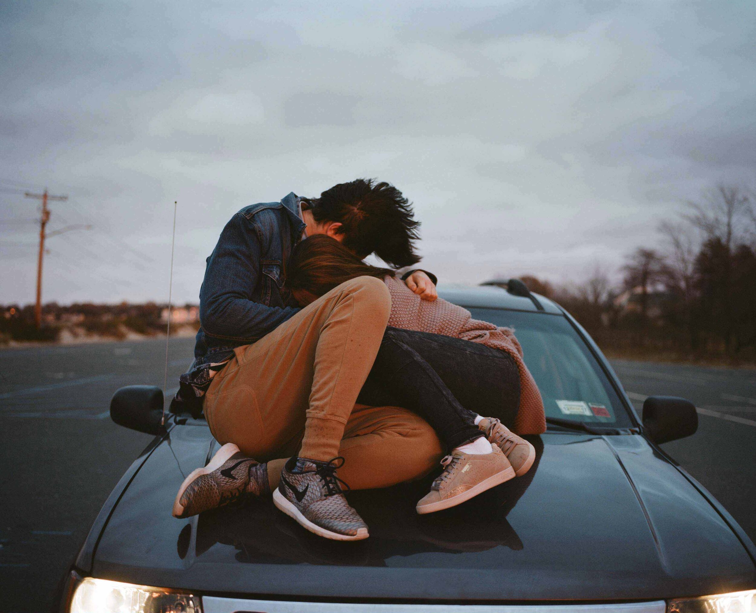 Parker and Nina Embrace on the Car (Bayville Beach), 2016