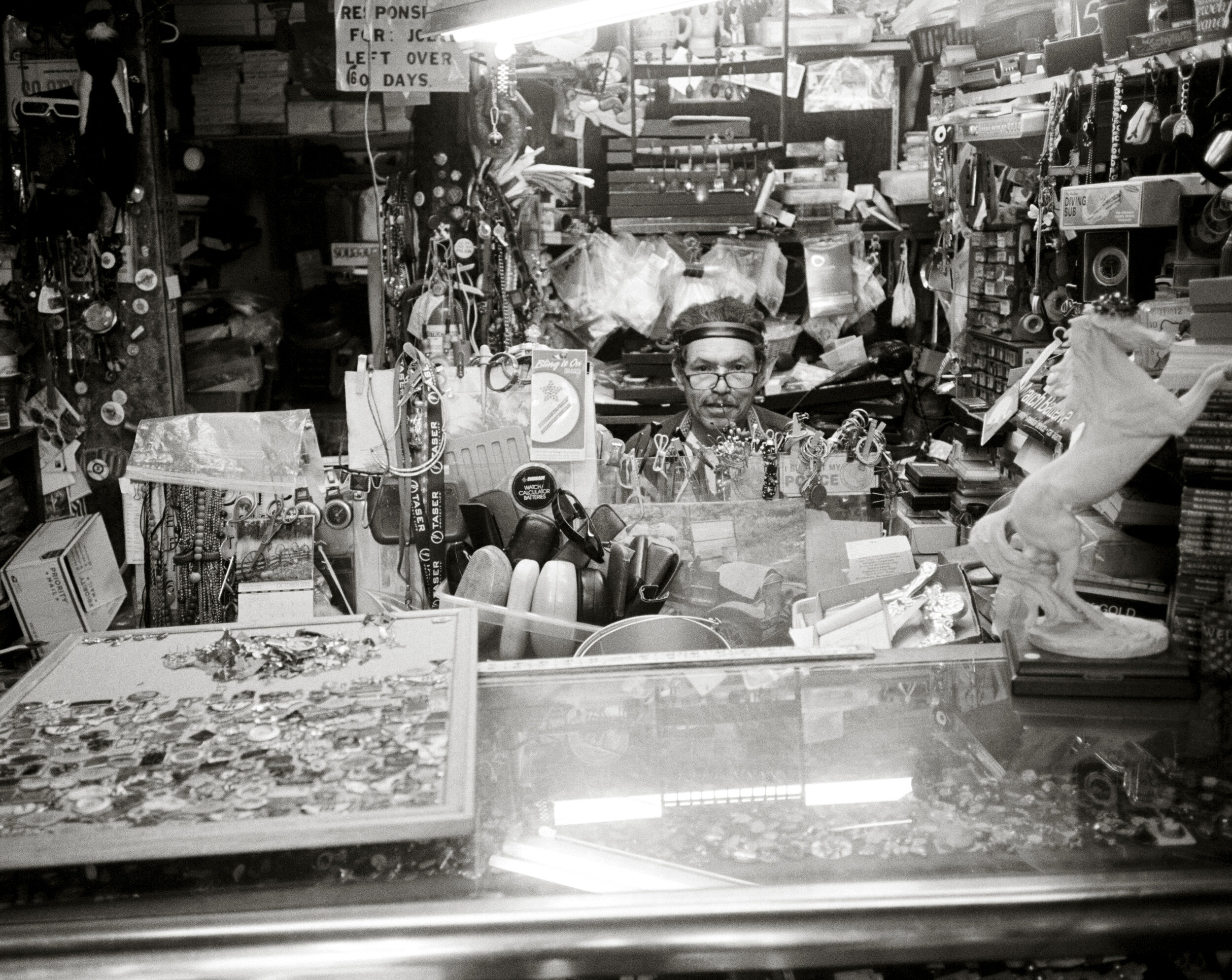   Tony at his desk, Tony’s Watch and Jewelry Repair,  2015, silver gelatin print 