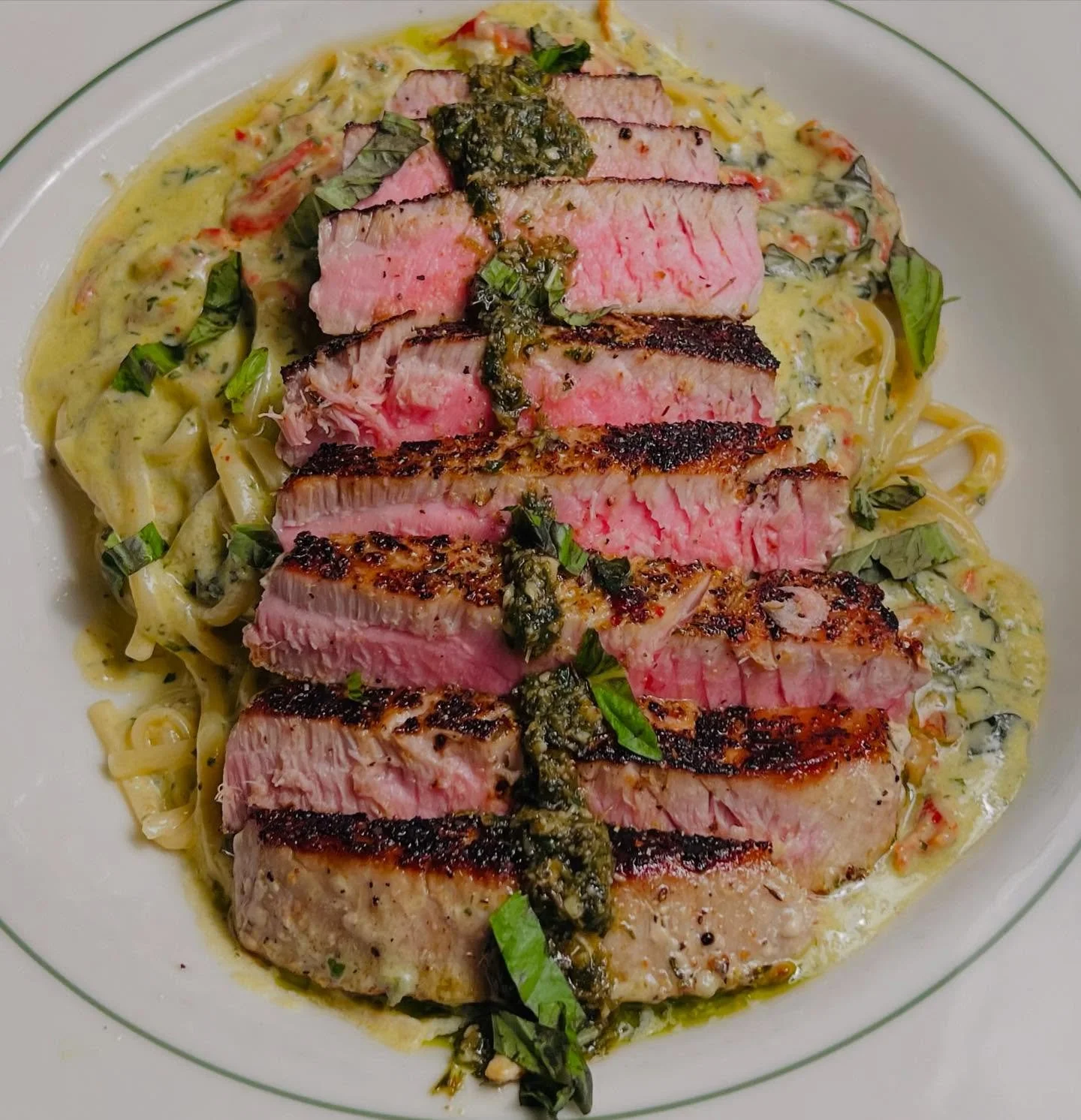 A yummy feature this evening, π£ catch it while you can!
π  Lemon Pepper Seared 8oz Tuna Steak Served over 
Basil Pesto and Sun-Dried Tomato Cream Sauce with Linguini