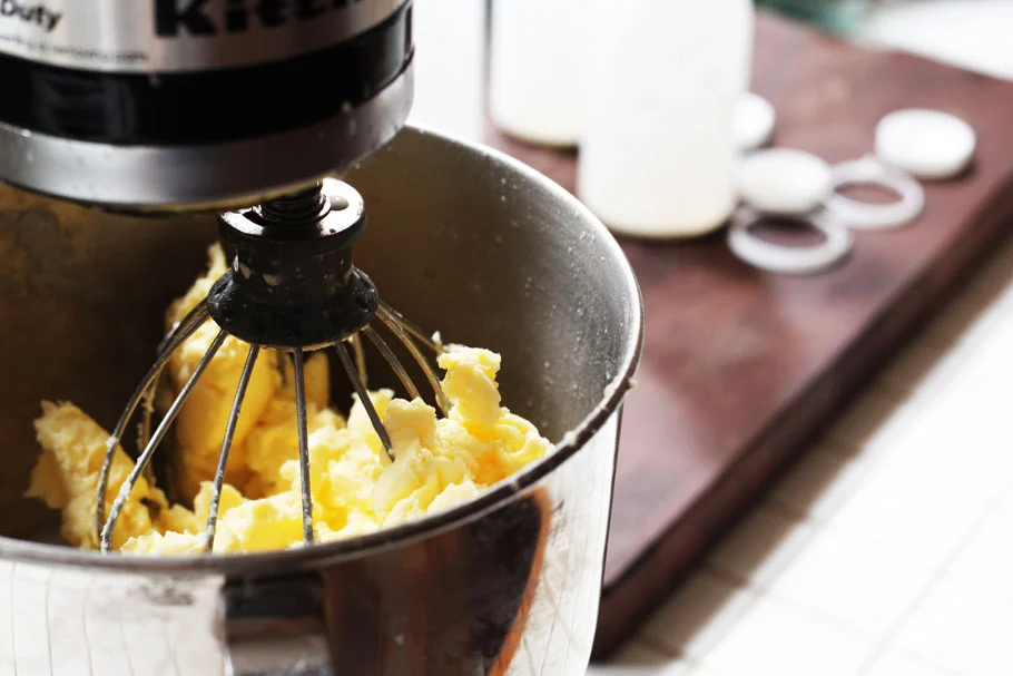 Put the cream in a heavy stand mixer fitted with a whisk attachment. Add a pinch of salt if you like and turn it on high.