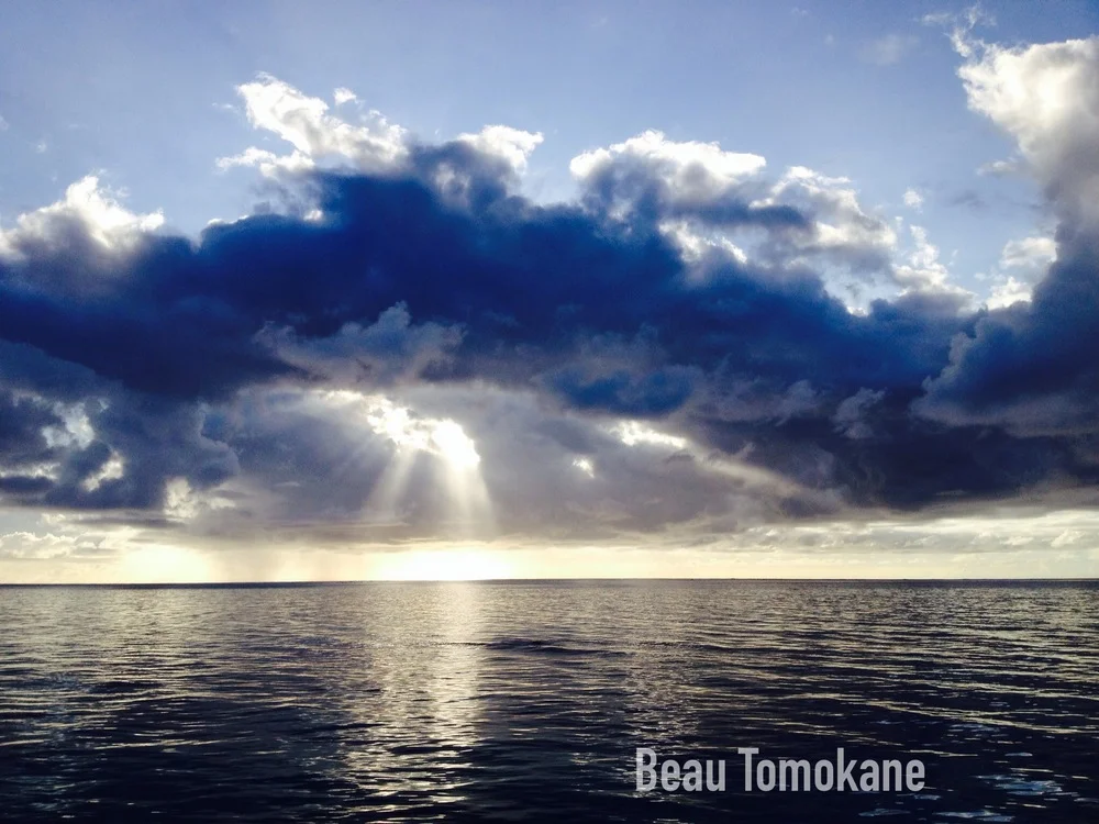 This is a beautiful picture of a sunset's beams coming through clouds and onto the ocean in one of Saipan's beaches. The photography is by our brother Beau Tomokane. He took it sometime later the day Mom died.