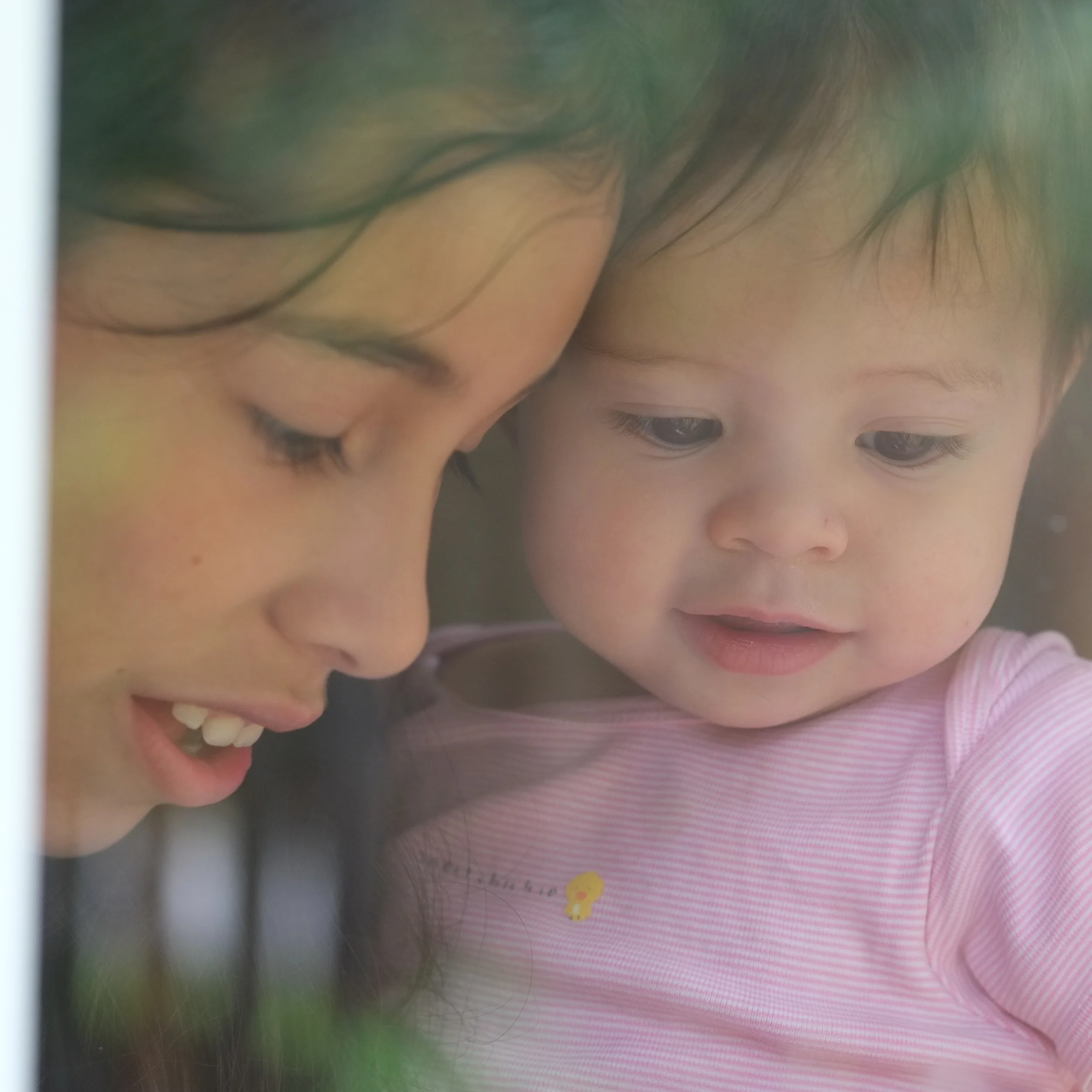 May 2014 - Pelaiah takes Shiloh to look at the flowers and vegetables from our organic garden