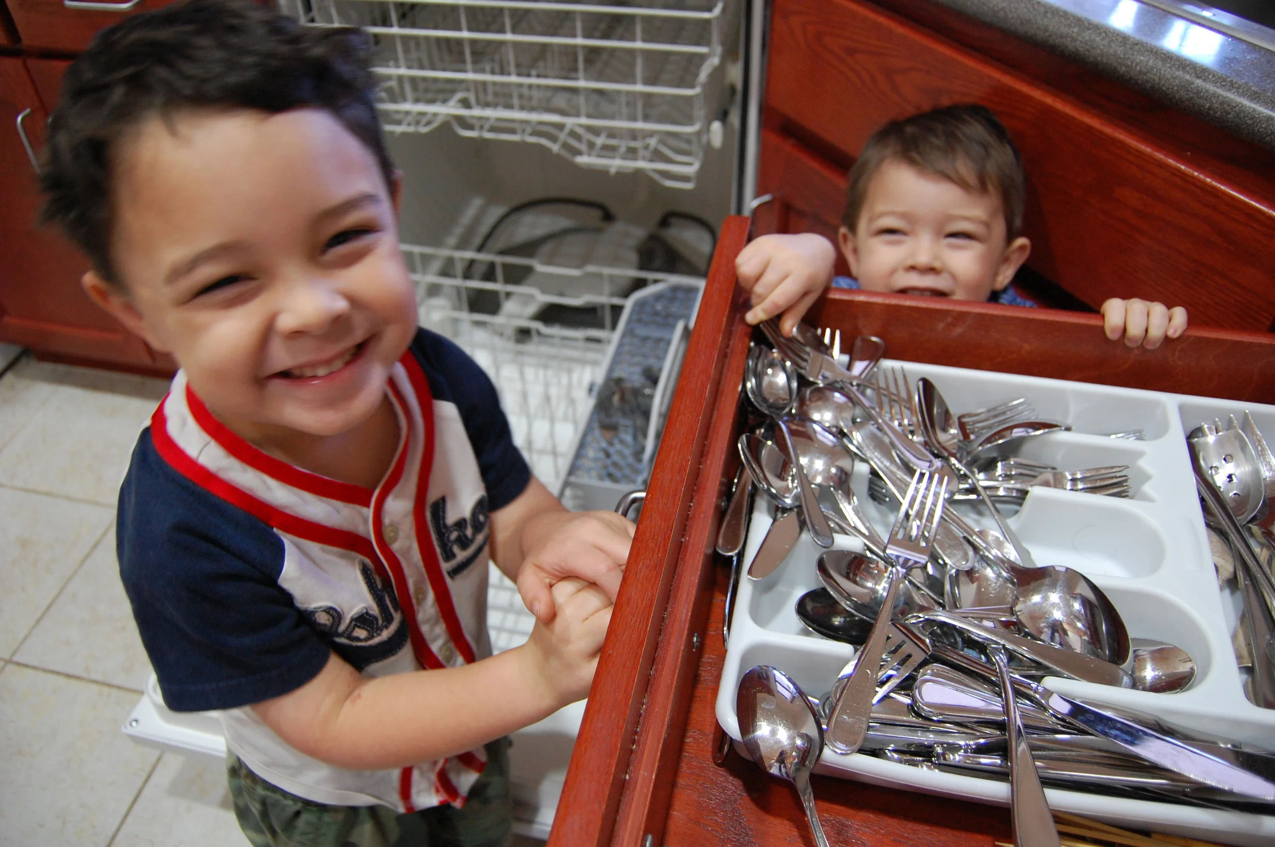 2011 - Abraham (4) and Noah (2) help by putting away the utensils and dishes from the dishwasher. It's a little messy, but at least they're in the correct general area! :) They love helping, and that's the way we like it.