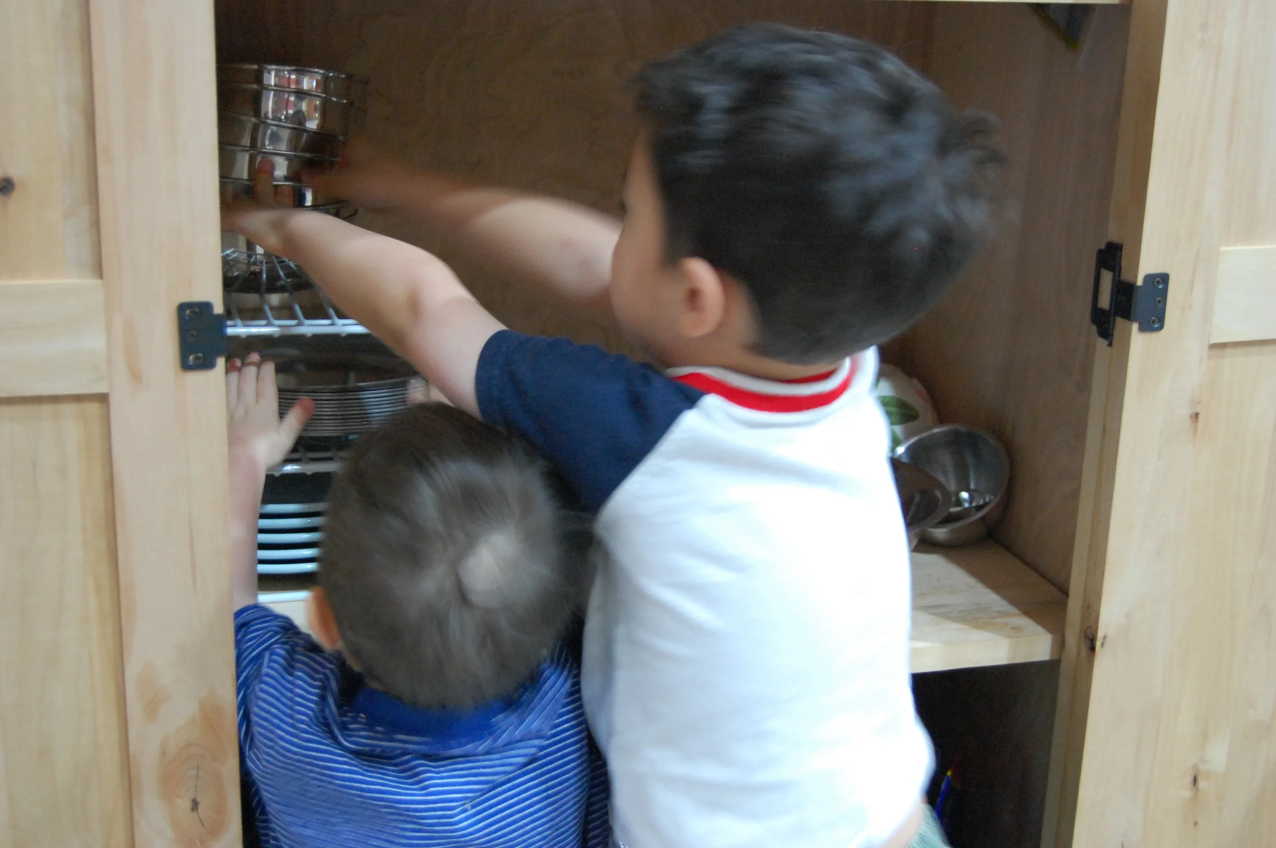 2011 - Noah (2) and Abraham (4) put away our stainless steel plates, bowls, and cups and enjoy stacking them. This was one of their favorite parts of unloading the dishwasher.