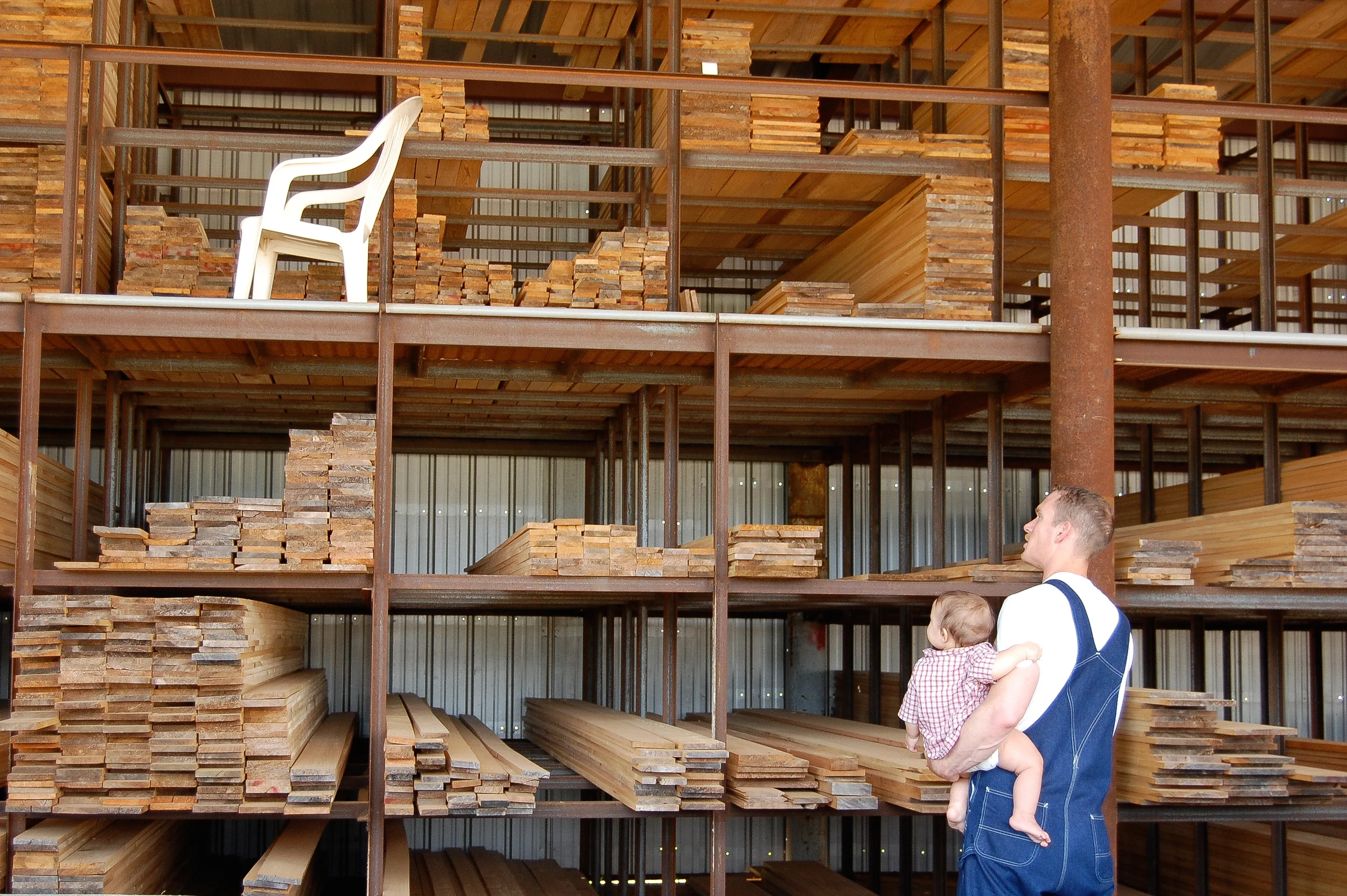 2008 - 11-month-old Abraham watches as Daddy chooses wood at the lumber mill