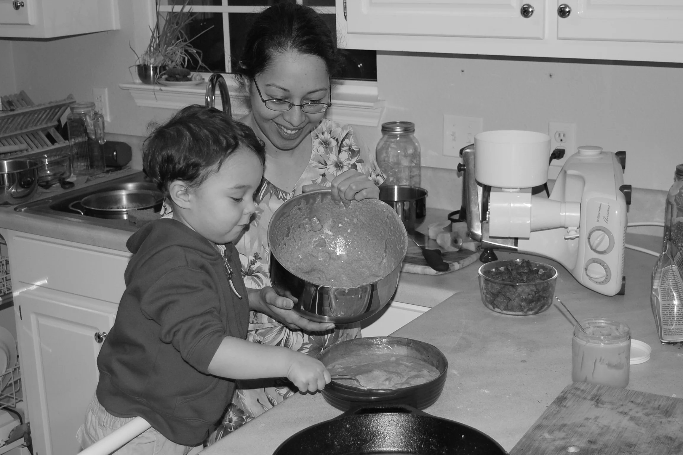 2009 - Abraham (2) loves to help Mommy smooth out the batter and anything else he can do in the kitchen -- especially taste the leftover batter in the bowl in the end.