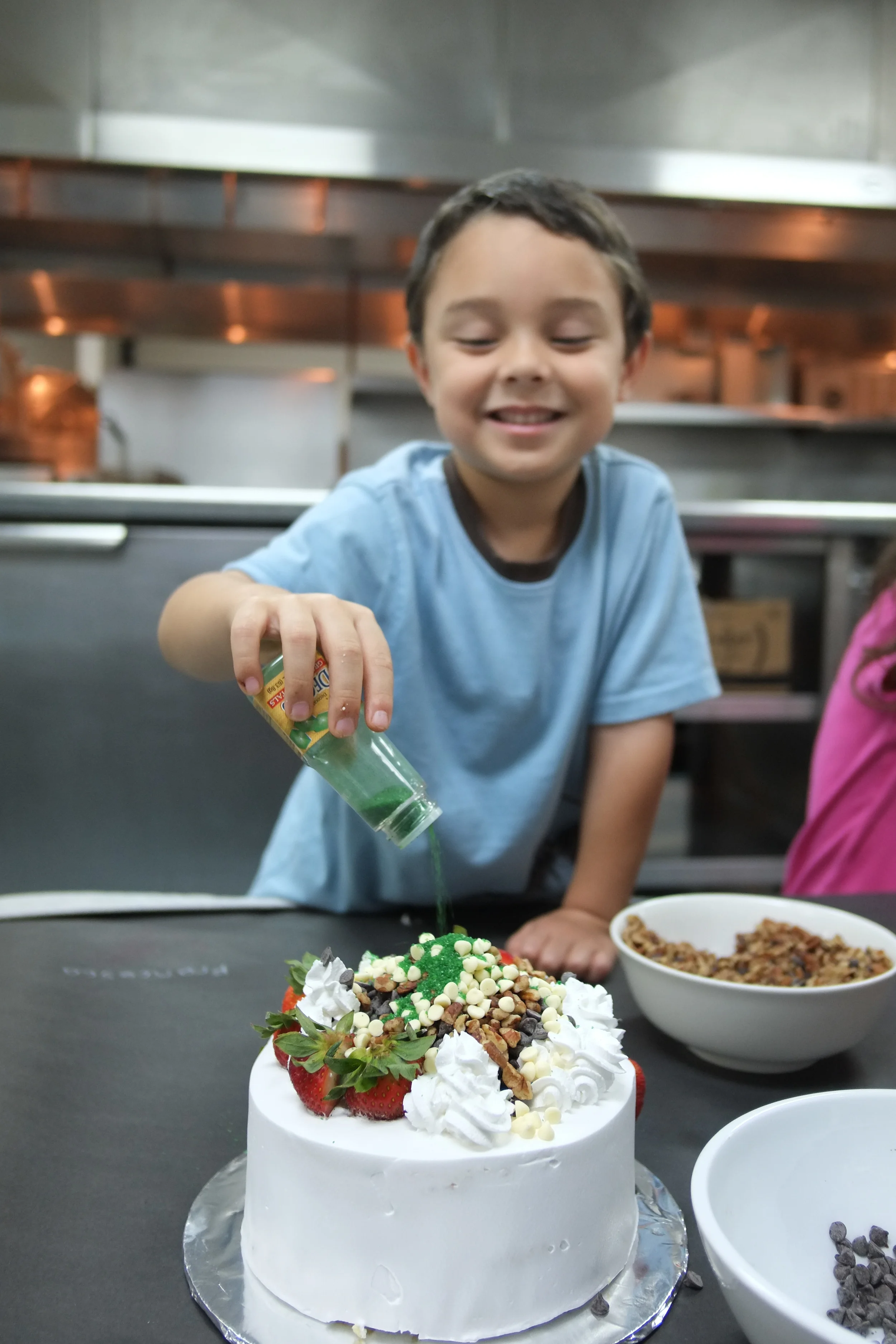 2012 - the children were given a special invitation by Executive Chef Budde of Hyatt Regency Guam while we were staying there. They got to take part in a special cake decorating class and got to top their cakes with all types of fresh fruit, nuts, and sweet toppings. After they were done, their cakes were boxed to "take home." We gave some away to relatives who lived on the island and shared some with some new friends and guests at the Regency Club Lounge .