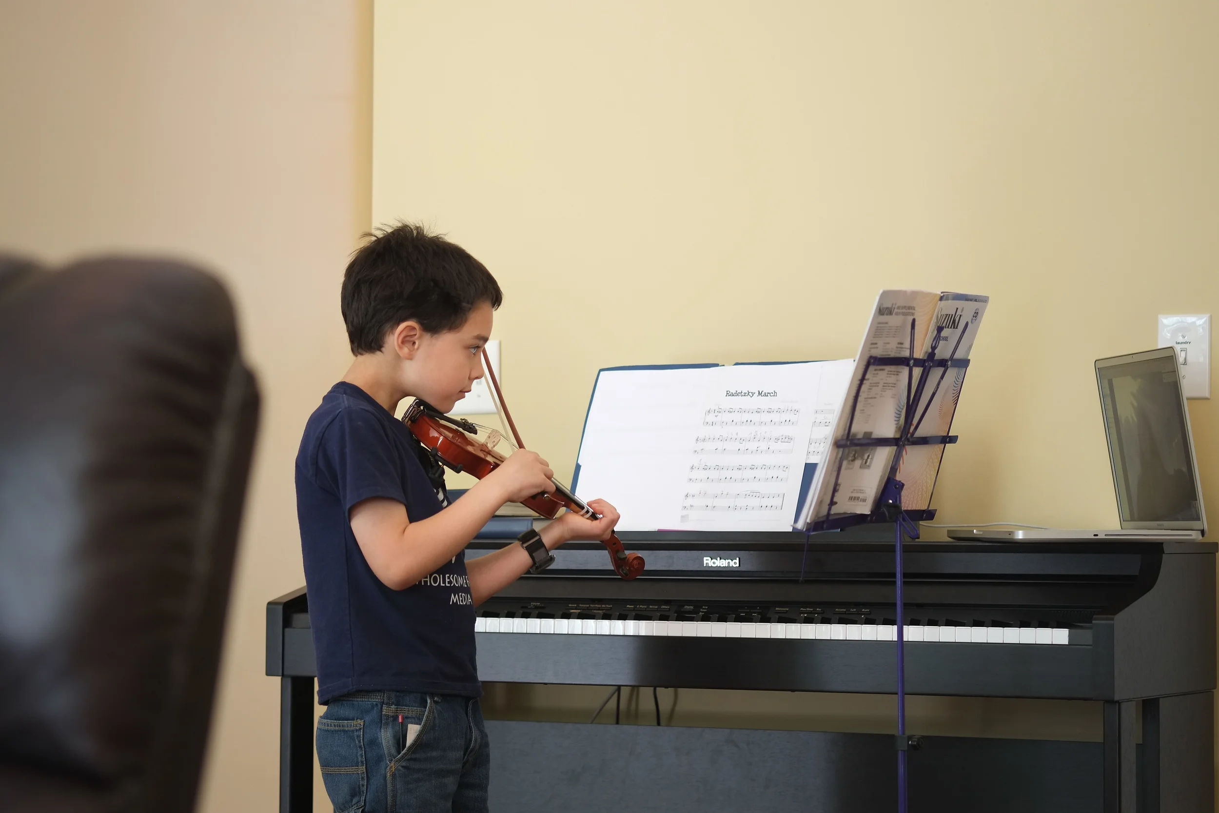 2015 - Abraham focusing on the instructions from his piano and violin instructor. When we moved, we transferred from private home lessons to using Skype with the same instructor. He is still a very diligent and patient student.