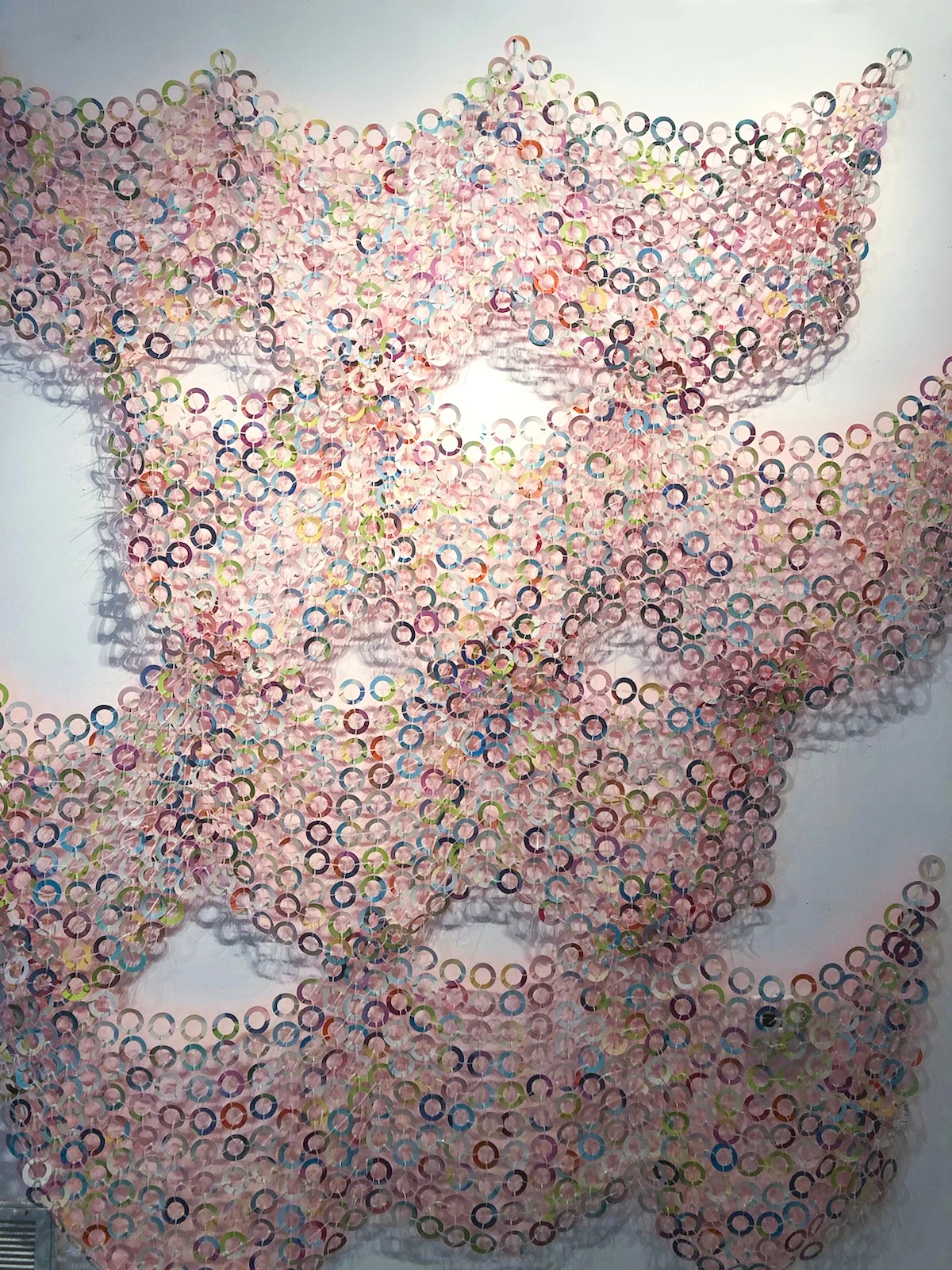 Astro-dot-net, 2010 Cut pieces of painting (acrylic and spray paint on Yupo paper) and zip ties