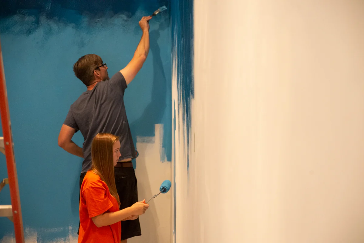 Matt Lively and Jane painting the studio