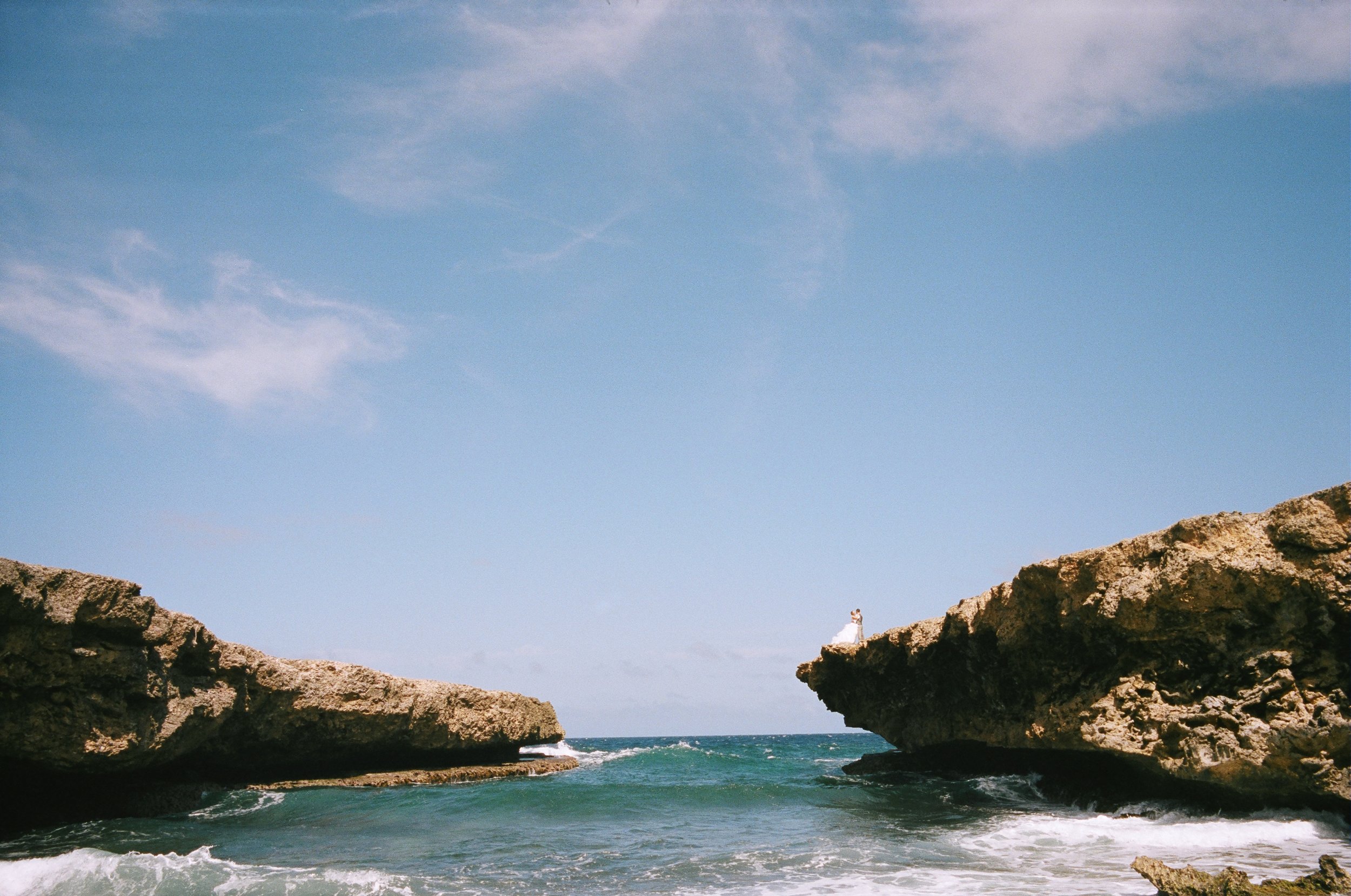 Bride and Groom on Ocean Cliff