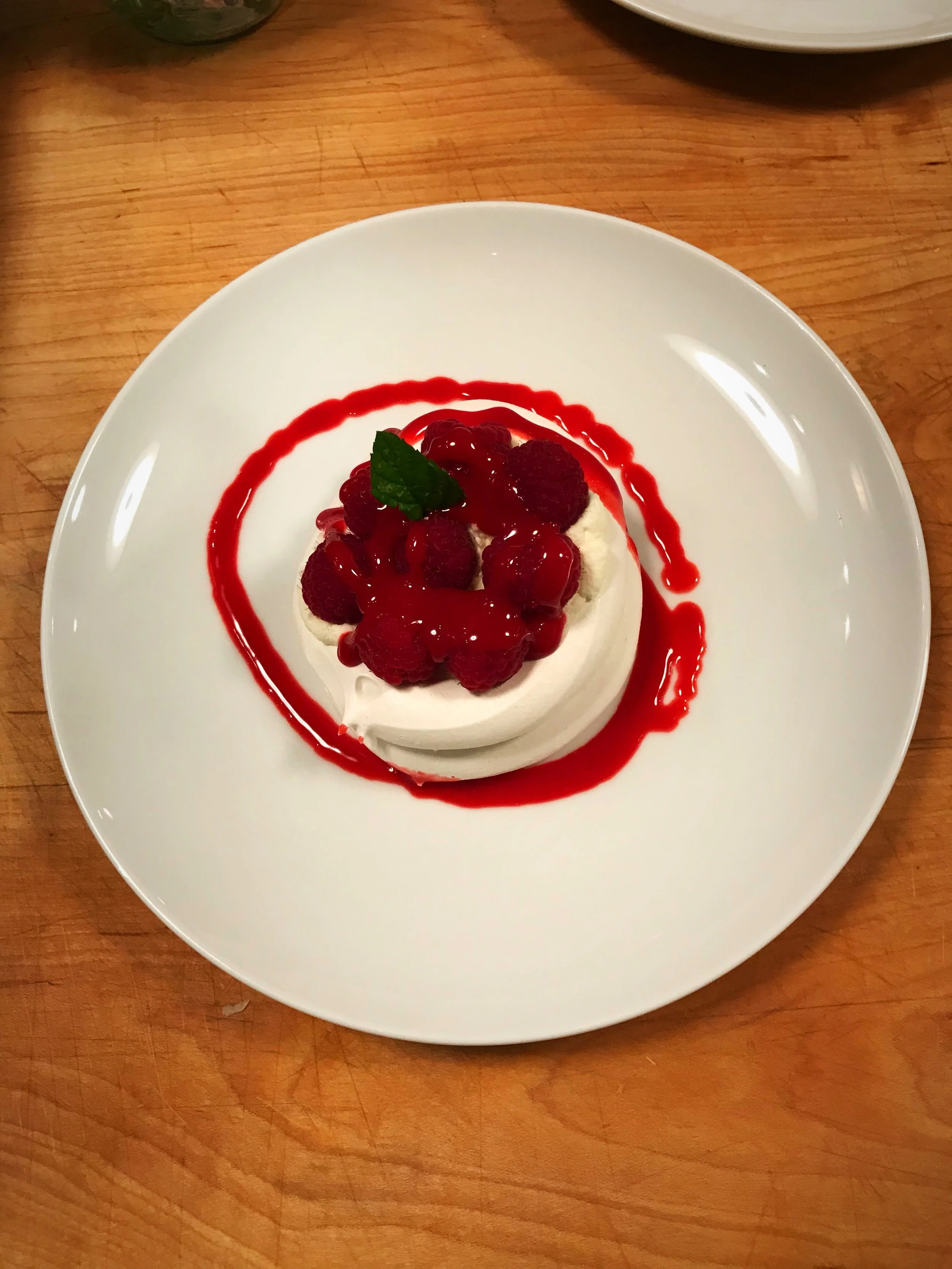 Walnut Meringue with Raspberry Prosecco Sauce