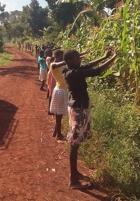2015 - The girls praying over the new land, asking God to provide for the construction of their new home.