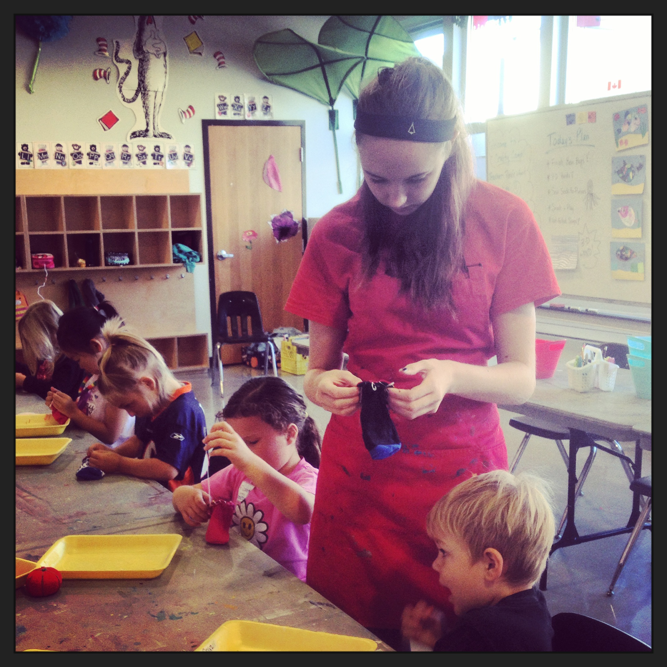 Hannah navigating a 'Sock-to-puss' problem at Summer Camp, 2014.