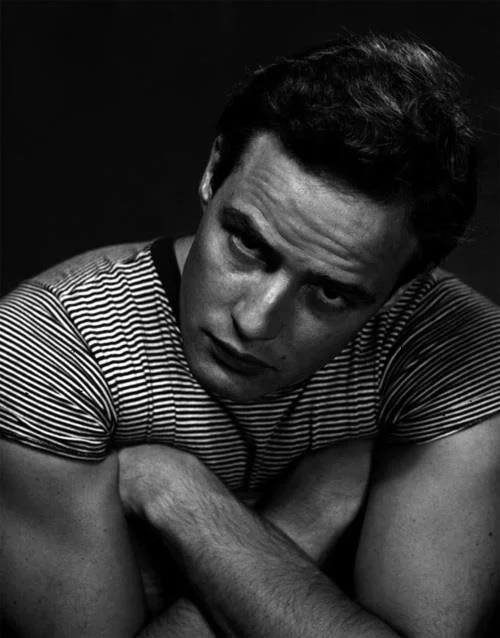 Classic striped tee- can't go wrong, especially with those guns. 