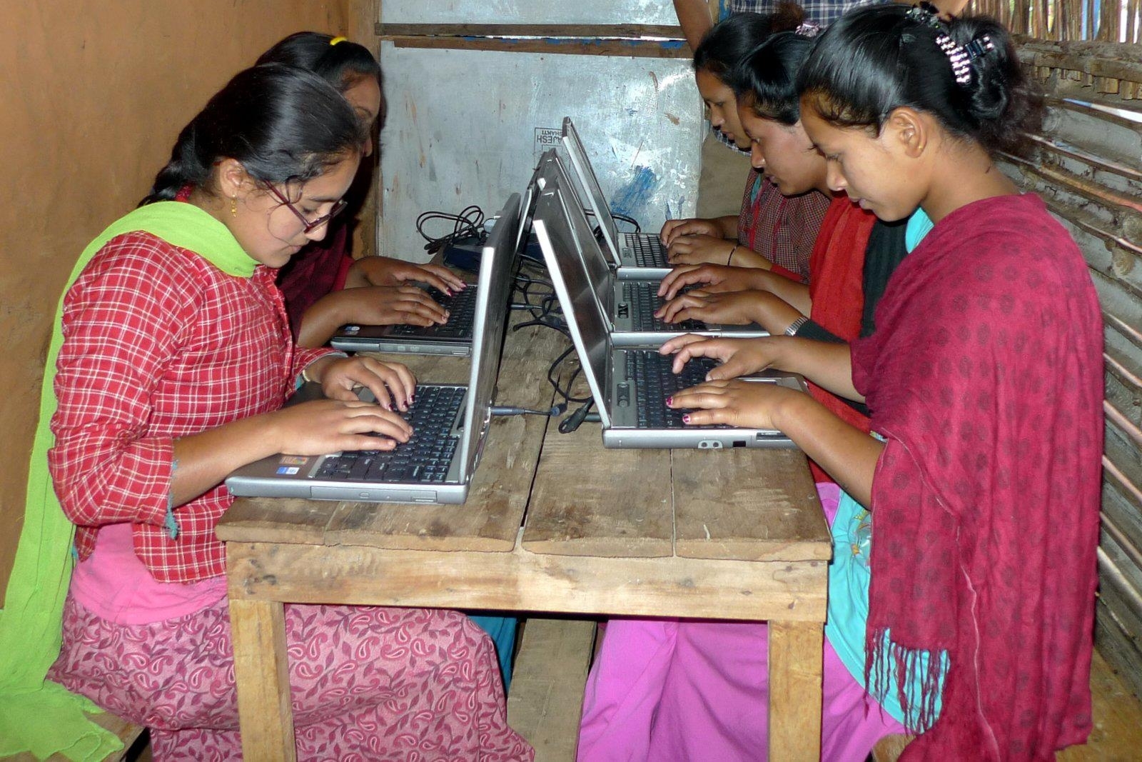 Village girls in after school computer training
