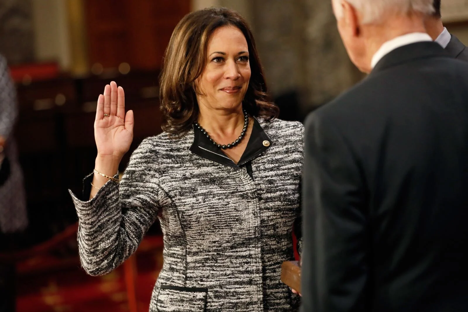 Harris, as a new member of the Senate, participates in a re-enacted swearing-in with Vice President Joe Biden in January 2017. She is the first Indian-American and the second African-American woman to serve as a US senator.  by Aaron P. Bernstein
