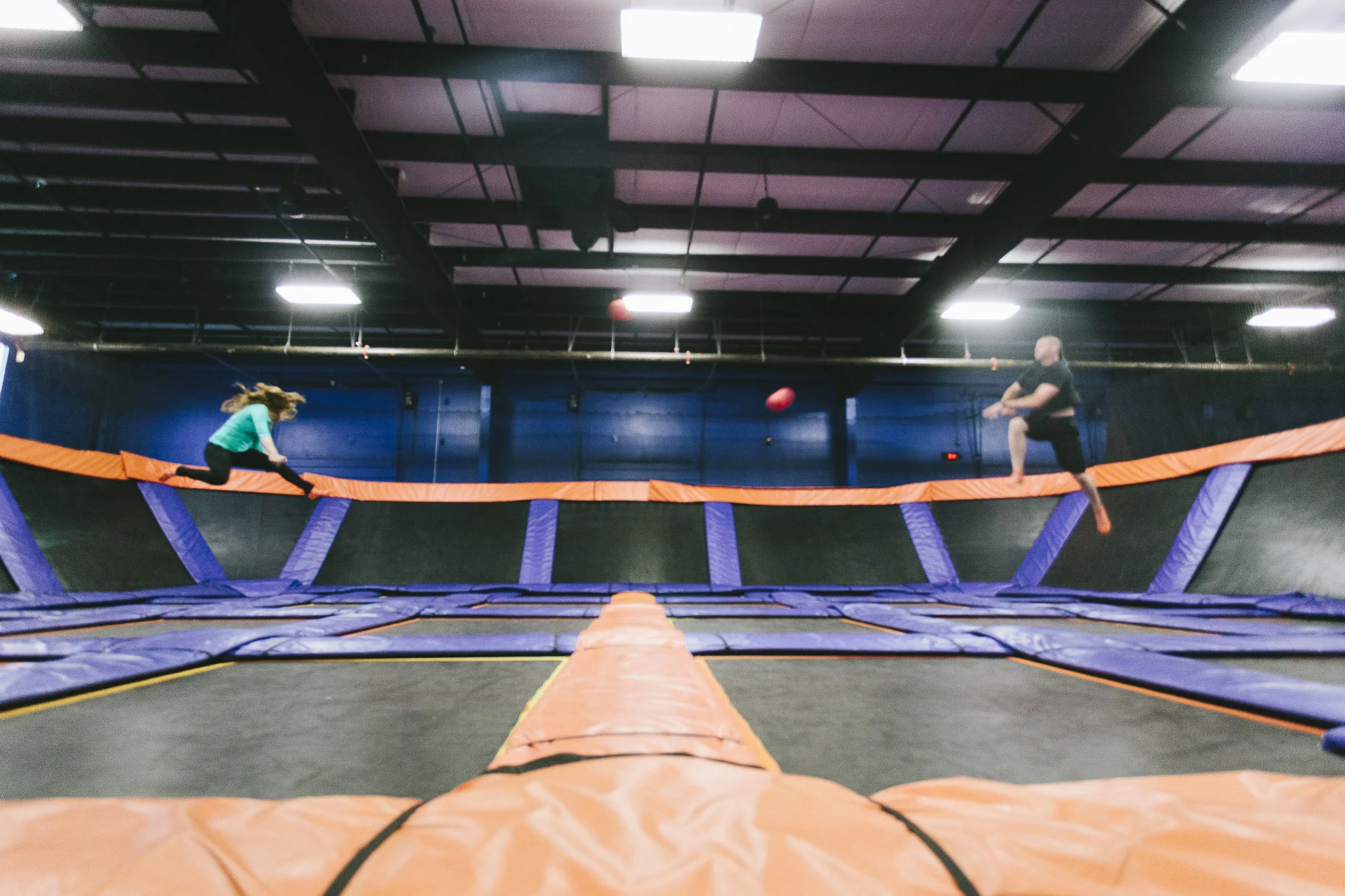 flying dodgeball trampoline couple