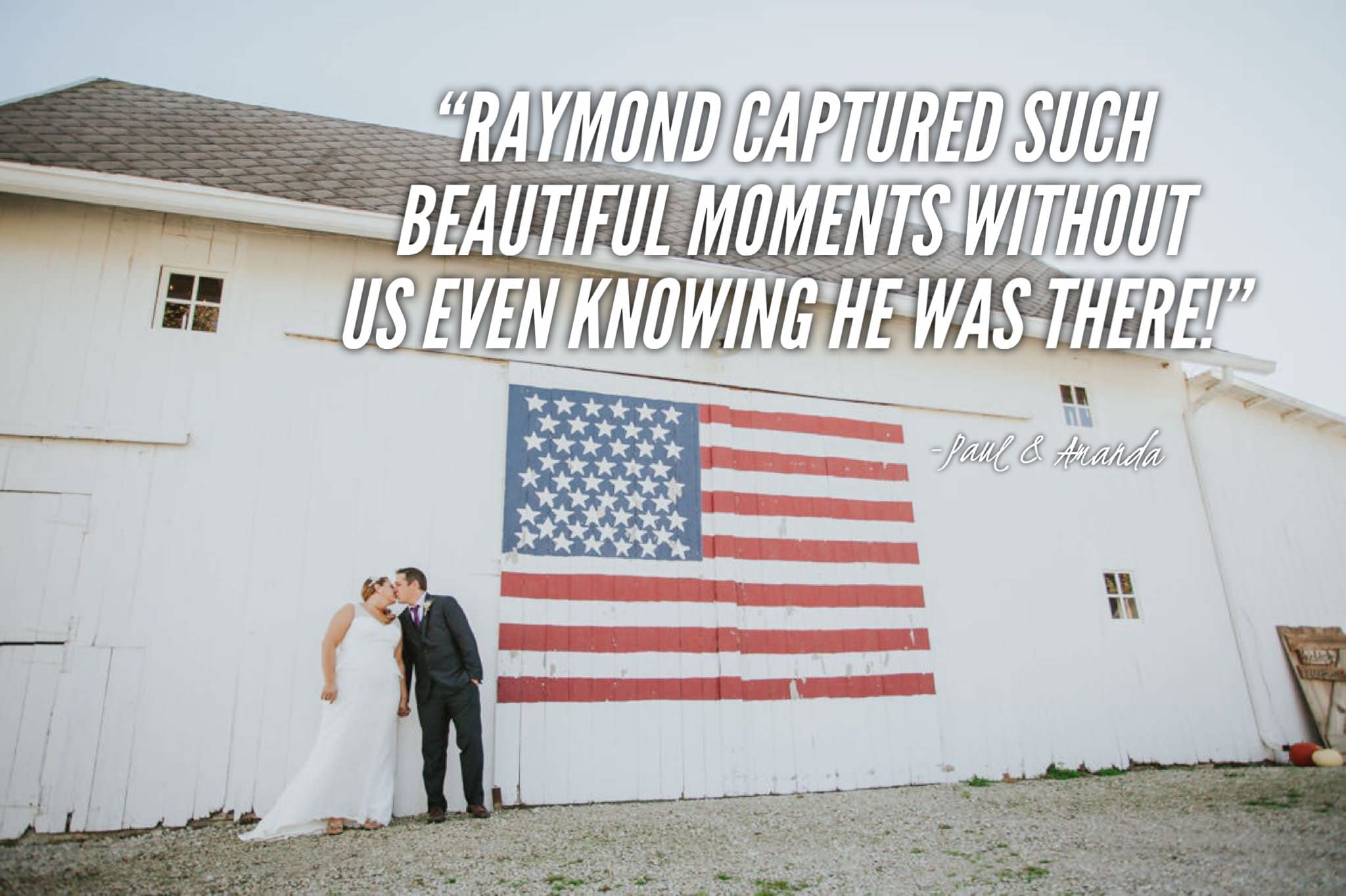 Married couple kissing in front of american flag wedding barn.jpg