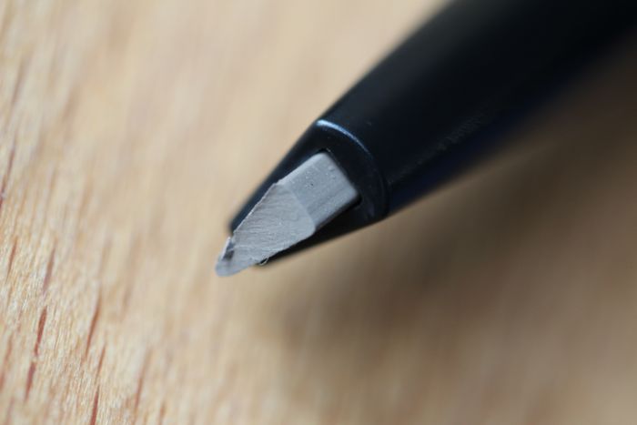 Triangular shaped, retractable tip