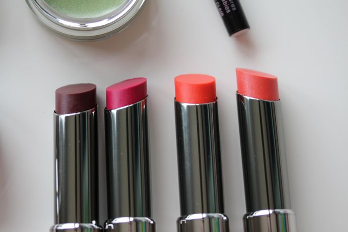 Mary Kay True Dimensions Lipsticks from left to right in Berry A La Mode, Sassy Fuchsia, Citrus Flirt and Tangerine Pop