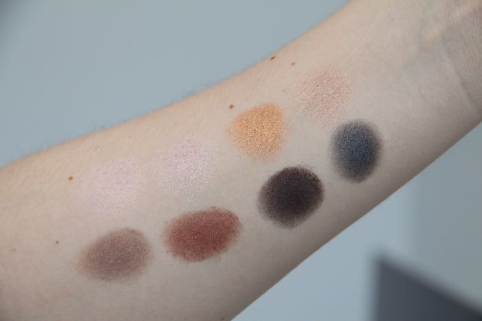 Pro Palette swatches from left to right starting on the top row: Nude, Champagne, Gold, Light Bronze, Pewter, Garnet, Deep Purple and Slate