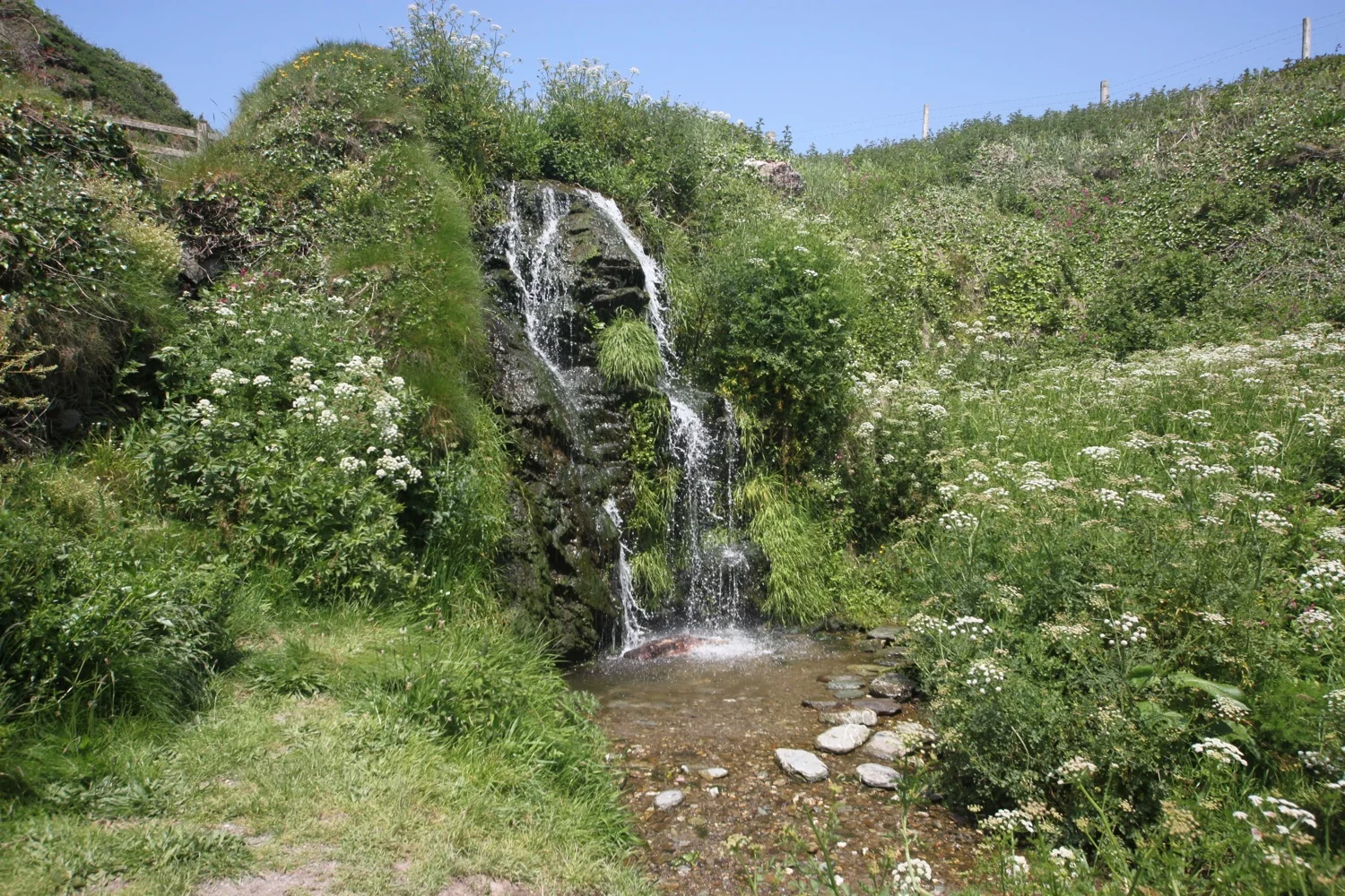 waterfall above lansallos beach