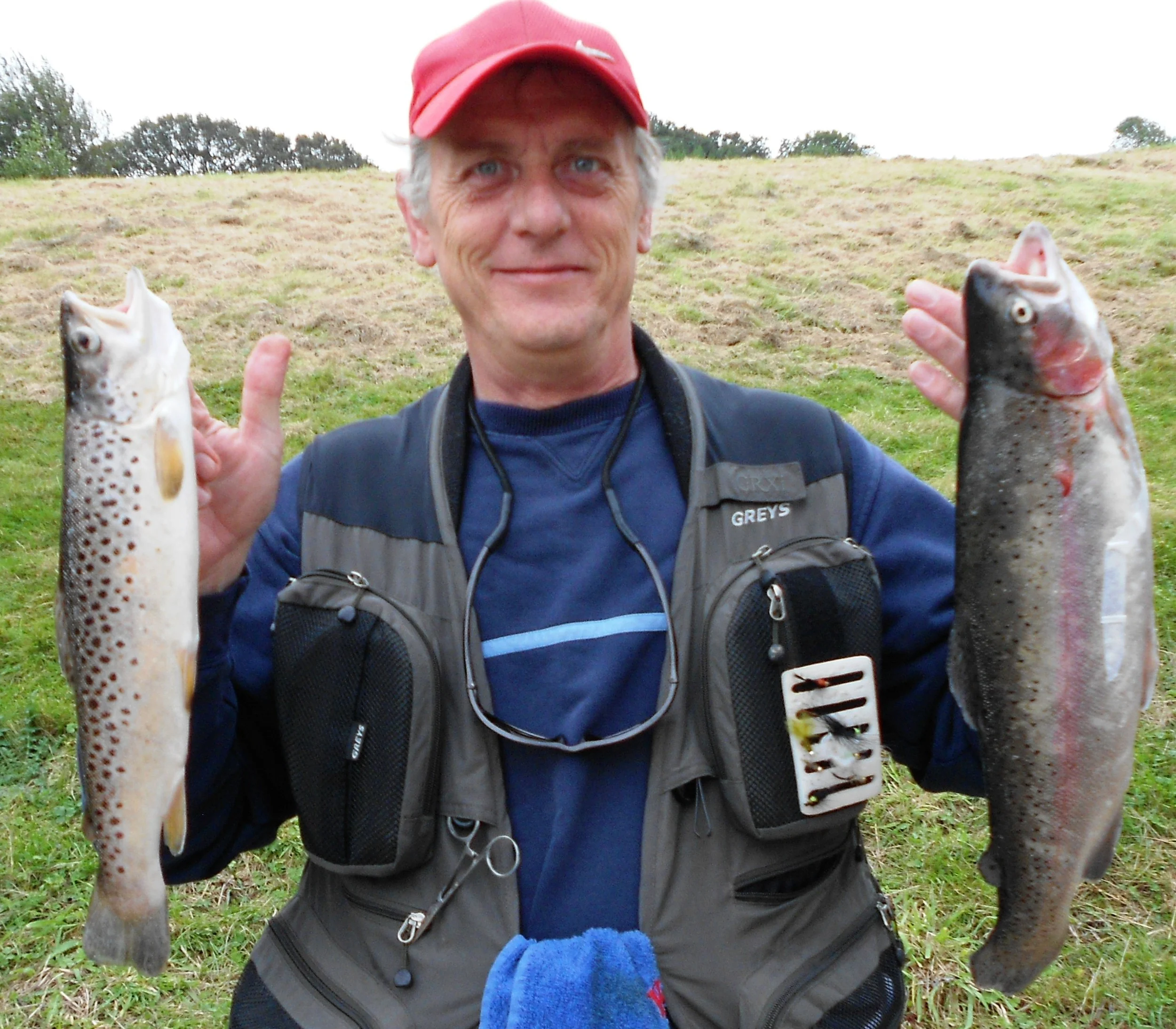 Sussex Fly Dressers Keith Verrall with his 3lb 5oz rainbow and 1lb 5oz brown