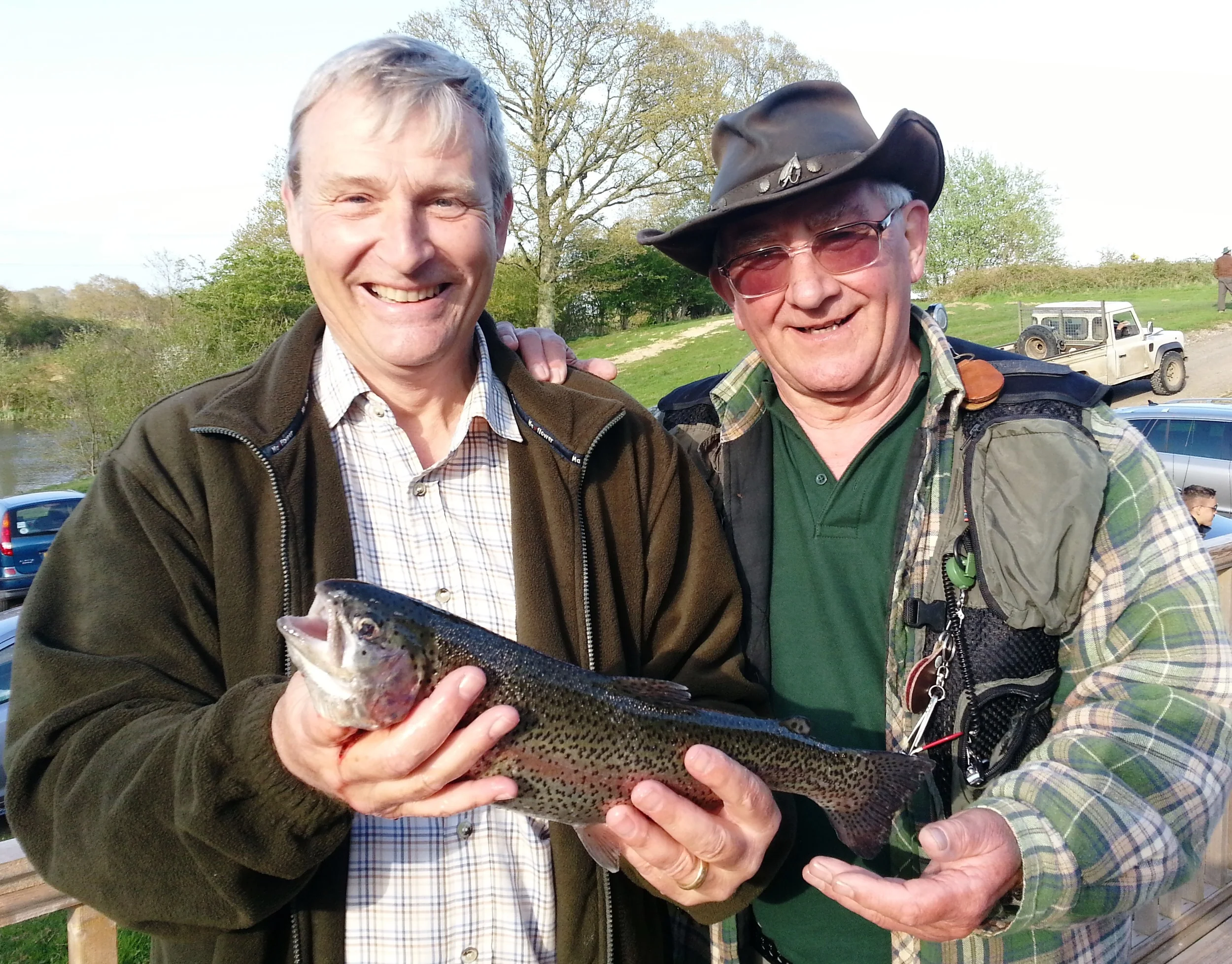 Paul Gietzen with his first ever fish helped by the experienced Fred Mitchell at Brick Farm’s fly fishing taster evening
