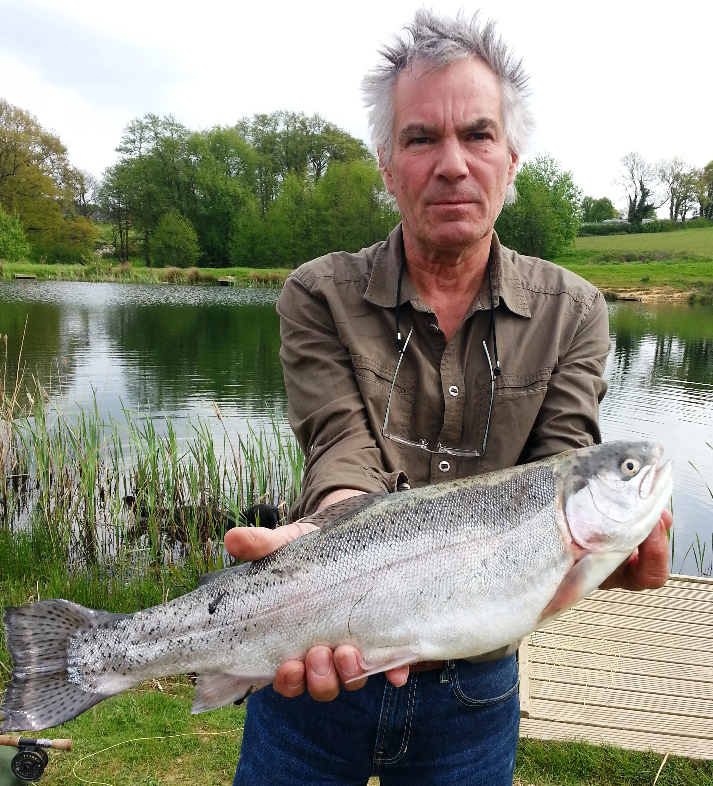 Graham Large bags a 5lb rainbowon the surface with an Orange Cats Whisker