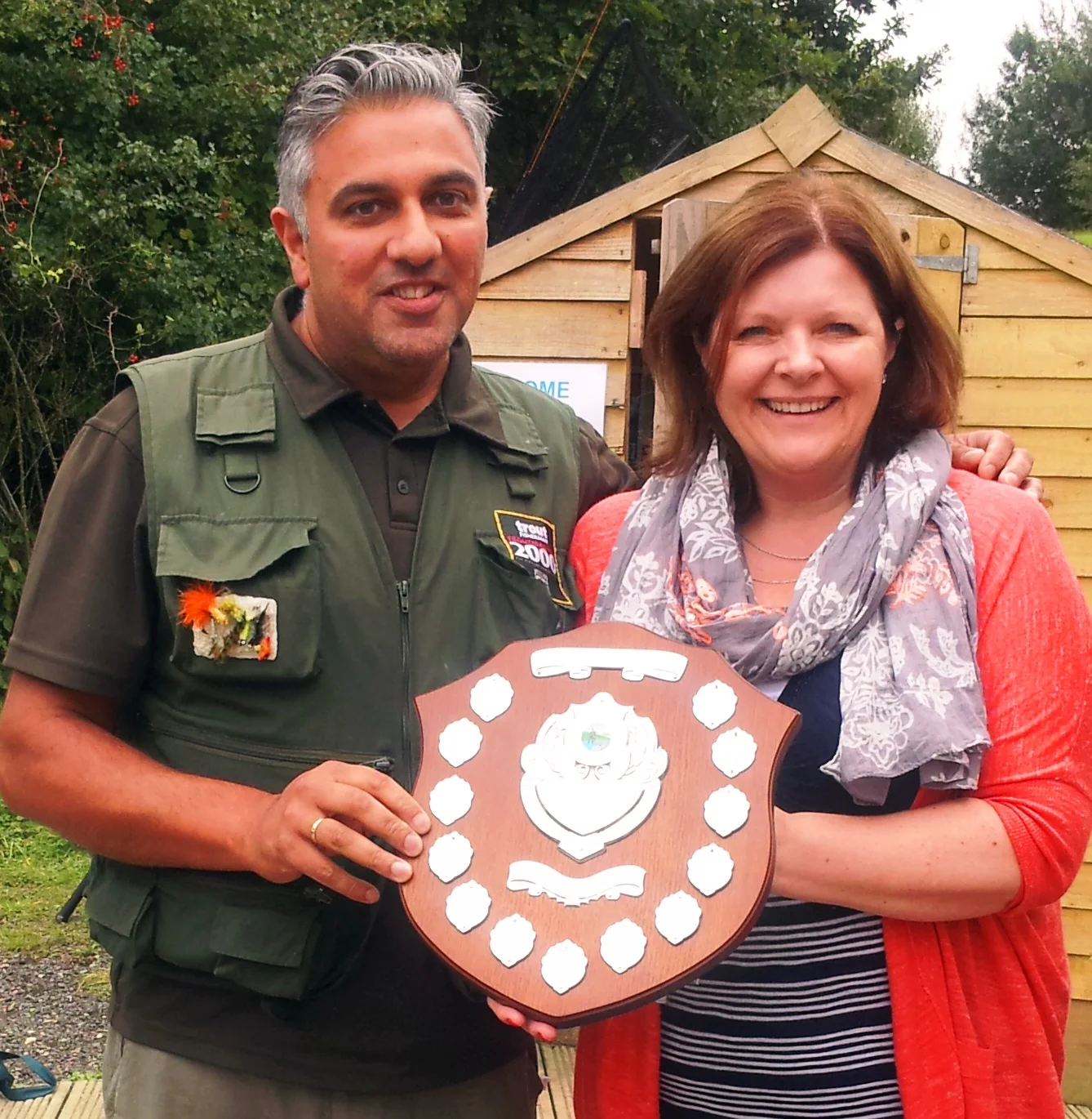 Last year's winner Rod Heeson receiving the St. Michael’s Hospice Allan Keates Memorial trophy