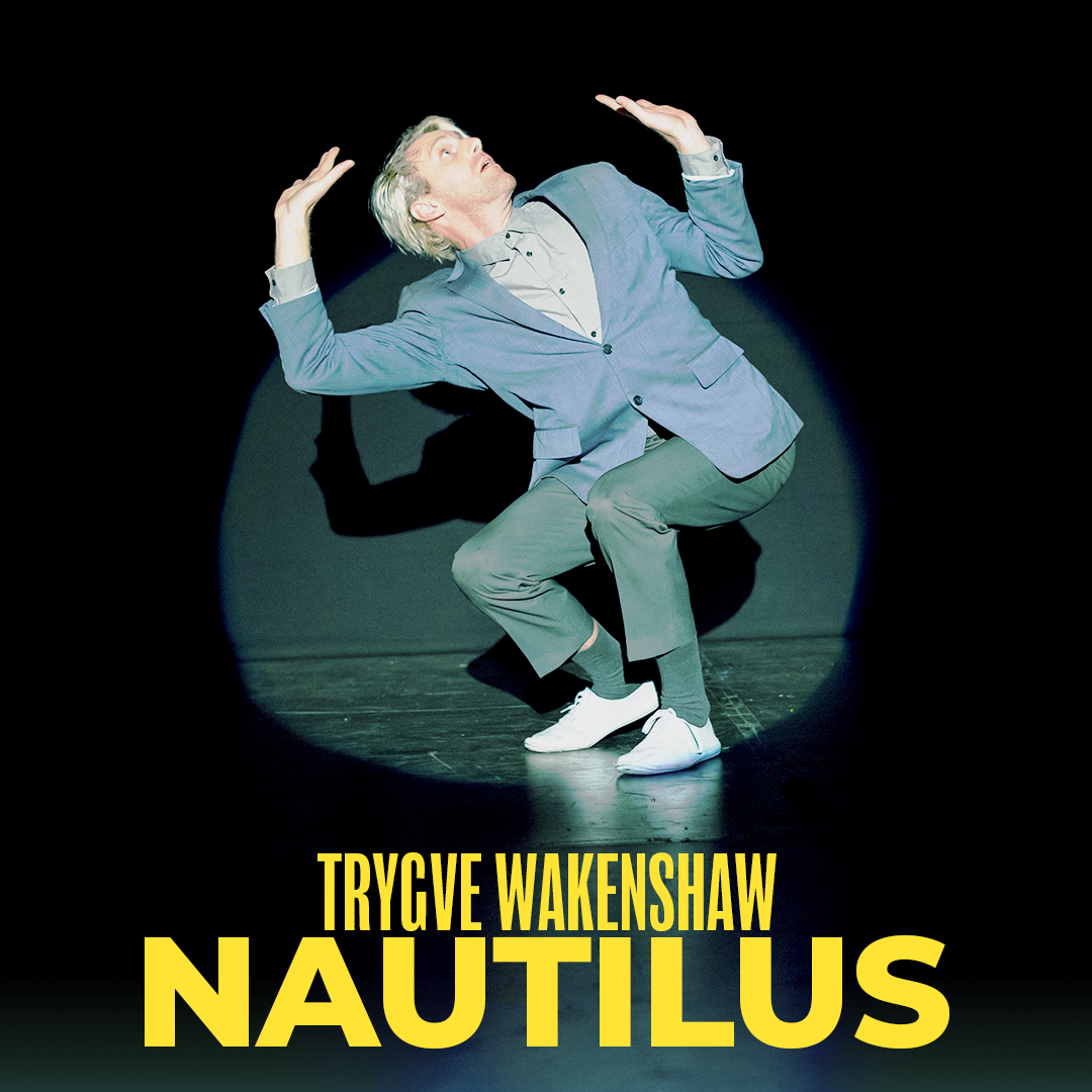 Mime Comedy from Trygve Wakenshaw's Nautilus Grey suited man trapped in a shrinking spotlight on stage