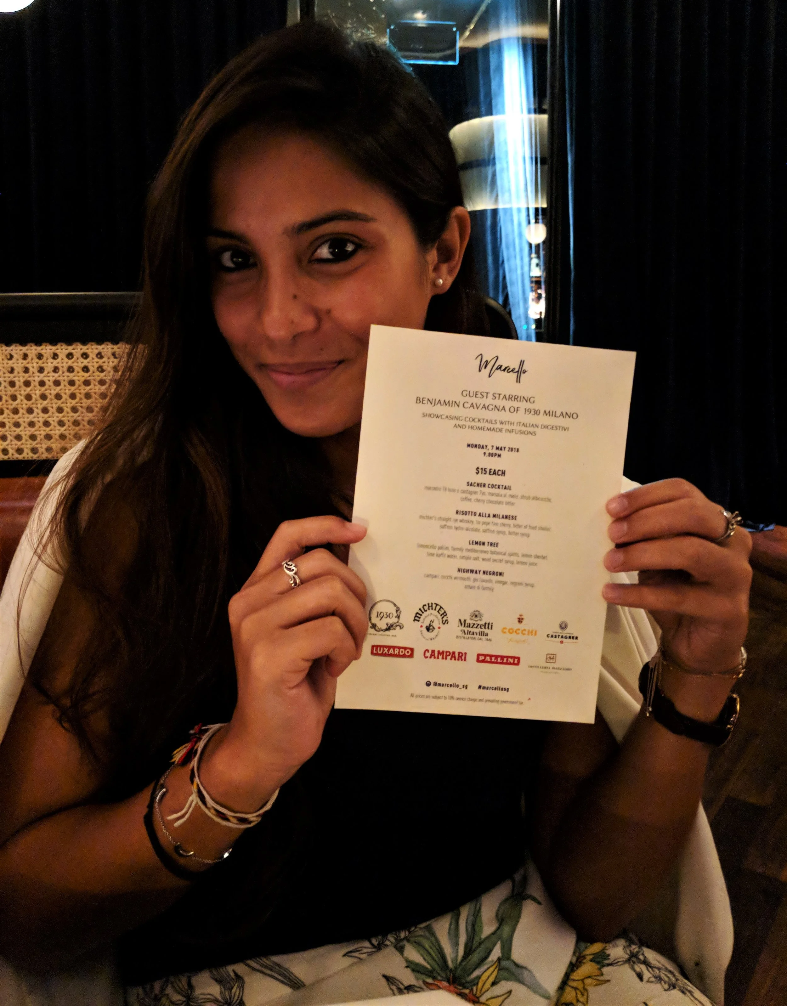 The beautiful Lorraine showing off the menu at Marcello